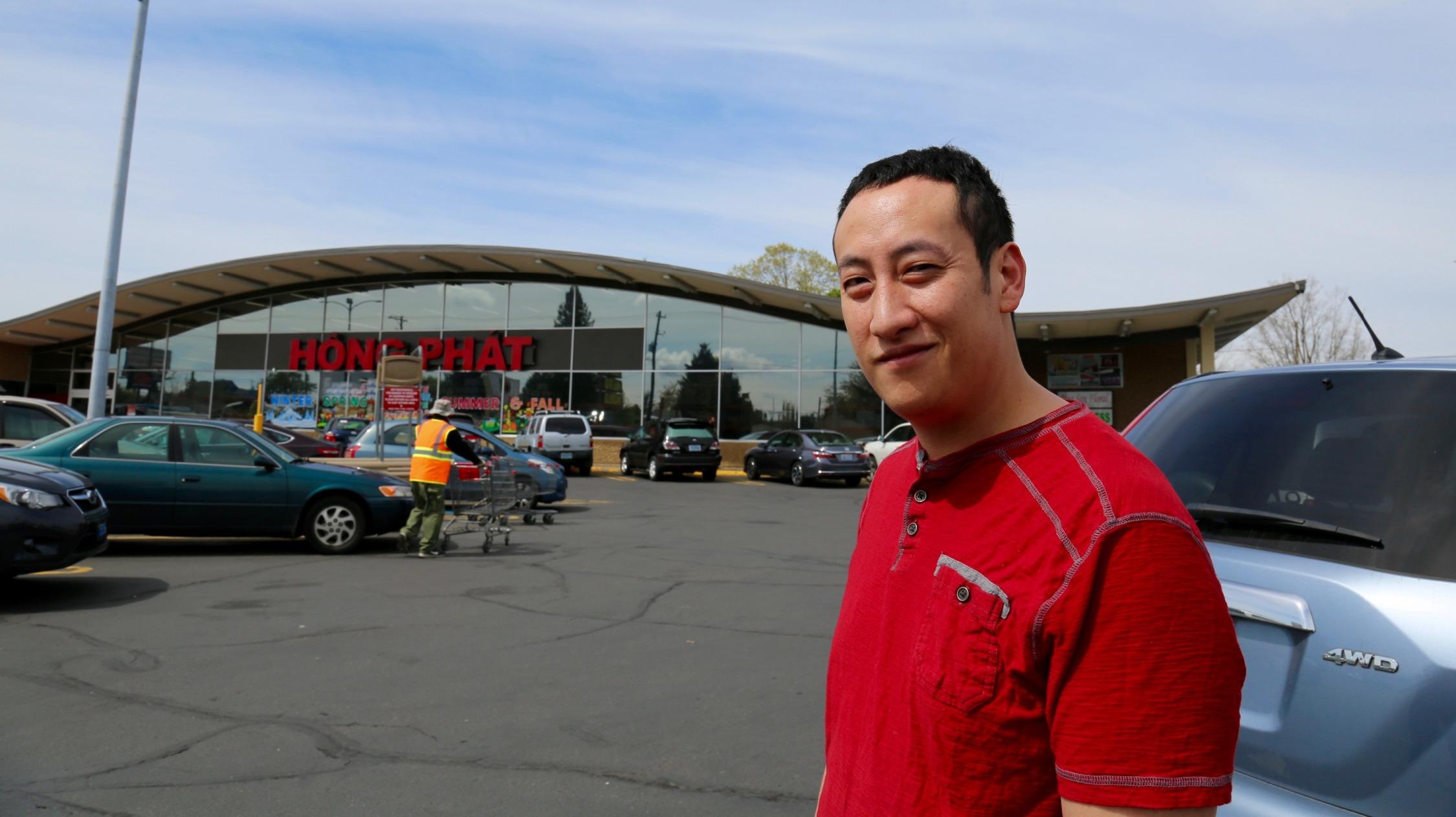 Hong Phat Food Center worker Chai Saeliew watched the protest from the store's parking lot. He's disappointed that the parade was canceled.