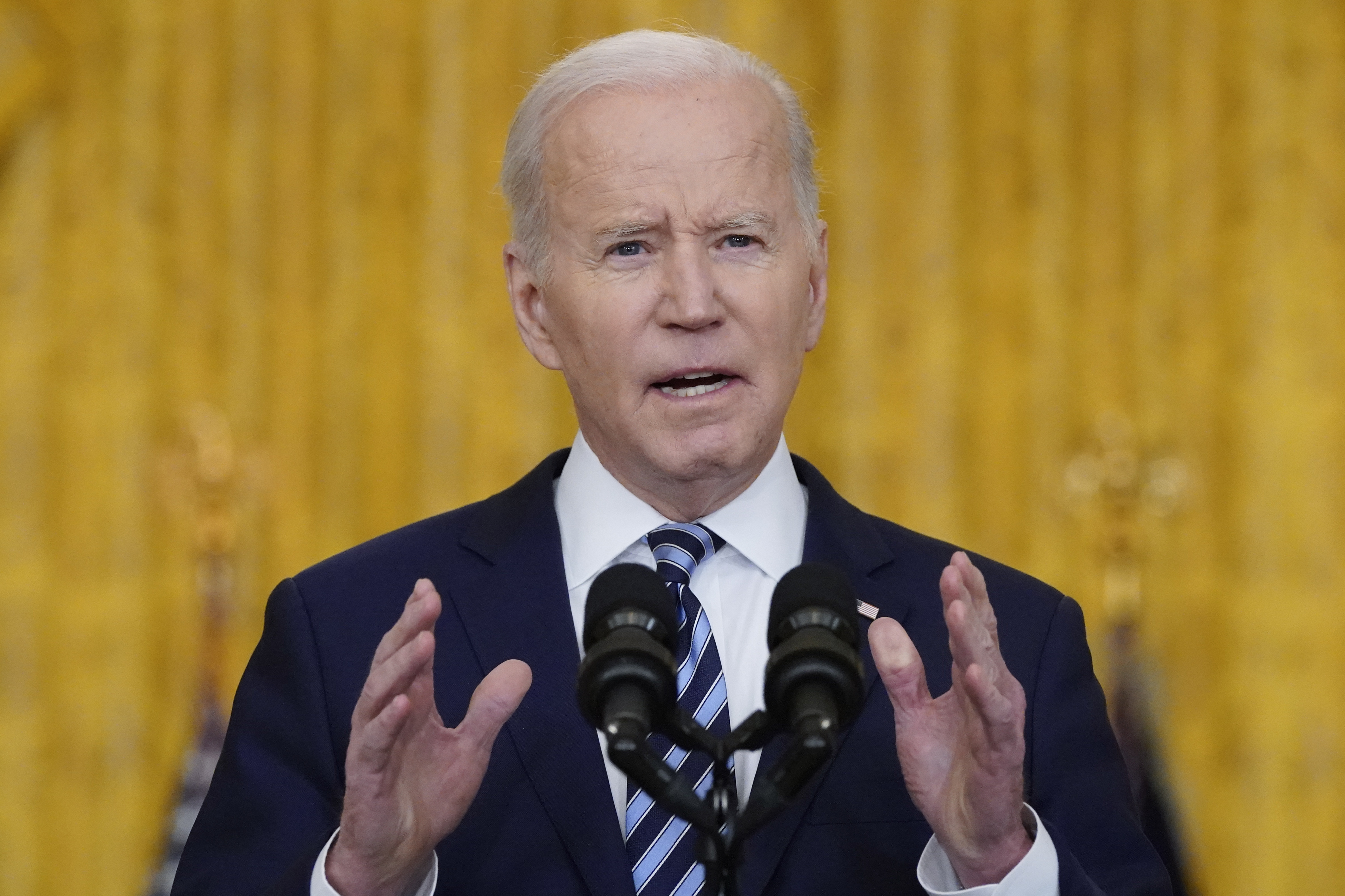 Biden hits Russia with sanctions, shifts troops to Germany - OPB