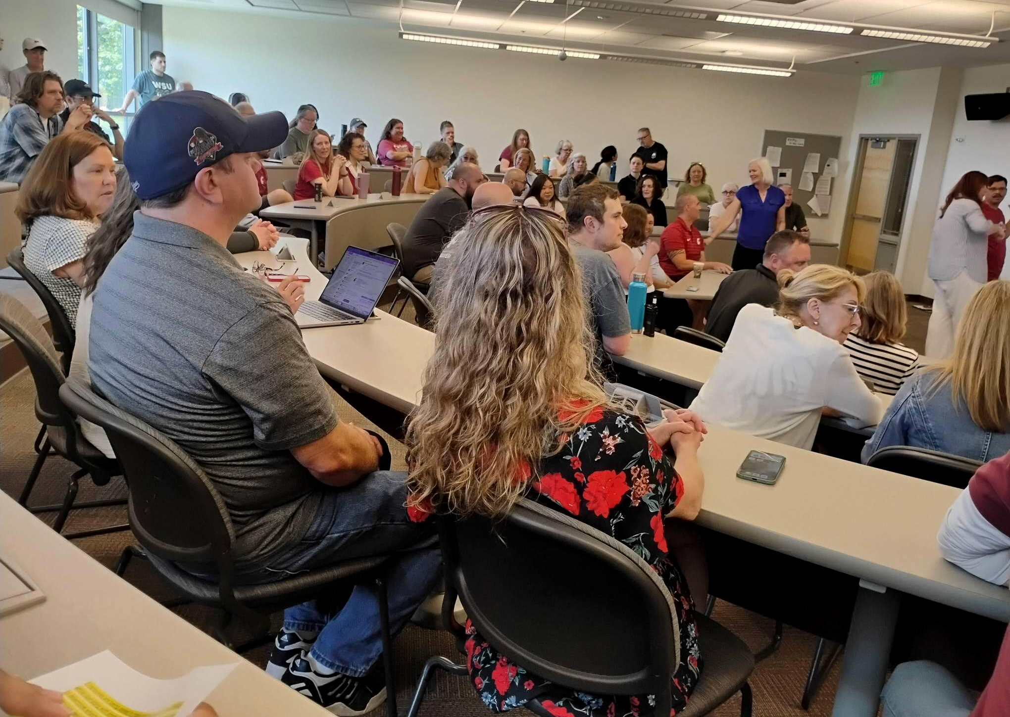 In this provided photo Washington State University Vancouver faculty and staff filled a budget town hall hosted by university administrators on Monday, June 15, 2026.