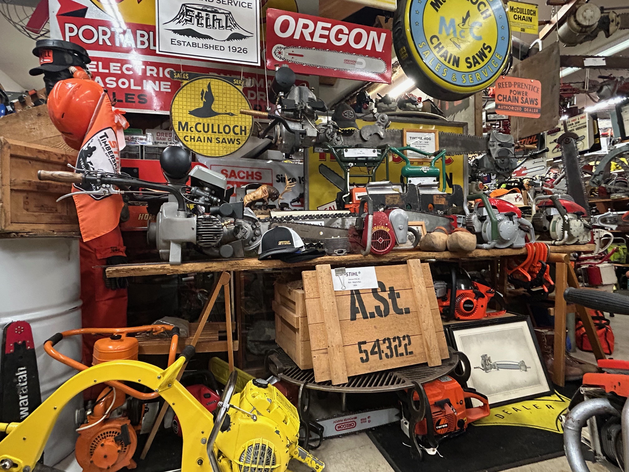 Wayne Sutton, the founder and curator of Wayne's Chainsaw Museum in Clark County, says his father helped him buy his first chainsaw when he was 7 or 8-years-old. That first chainsaw was a McCulloch Mac 1-10 model. This view taken inside the museum on Jan. 22, 2026 shows signage memorabilia advertising McCulloch chainsaws.