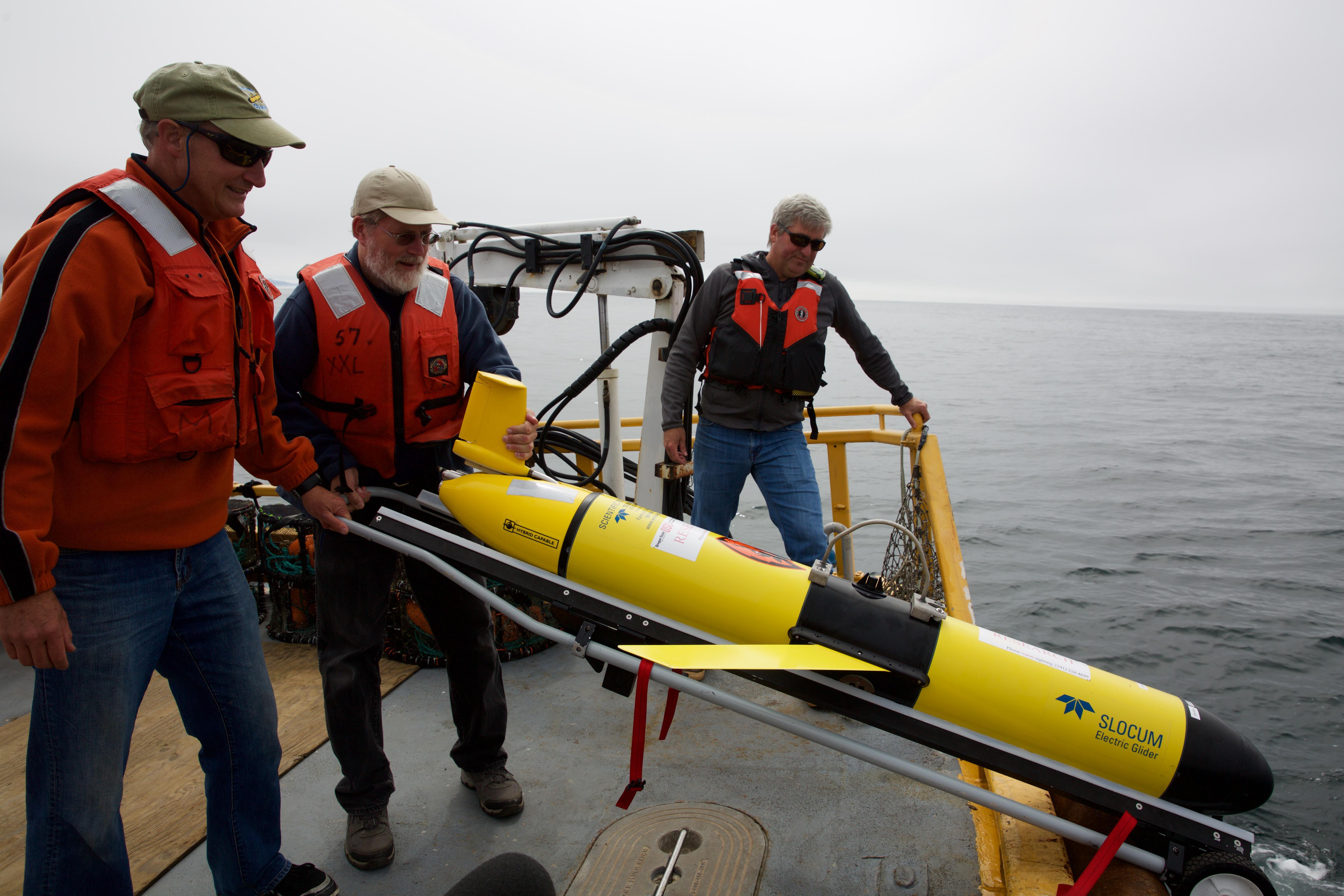 Scientists prepare to launch the Slocum Glider. It'll fly through the ocean for weeks by itself, collecting data on everything from dissolved oxygen to salinity.