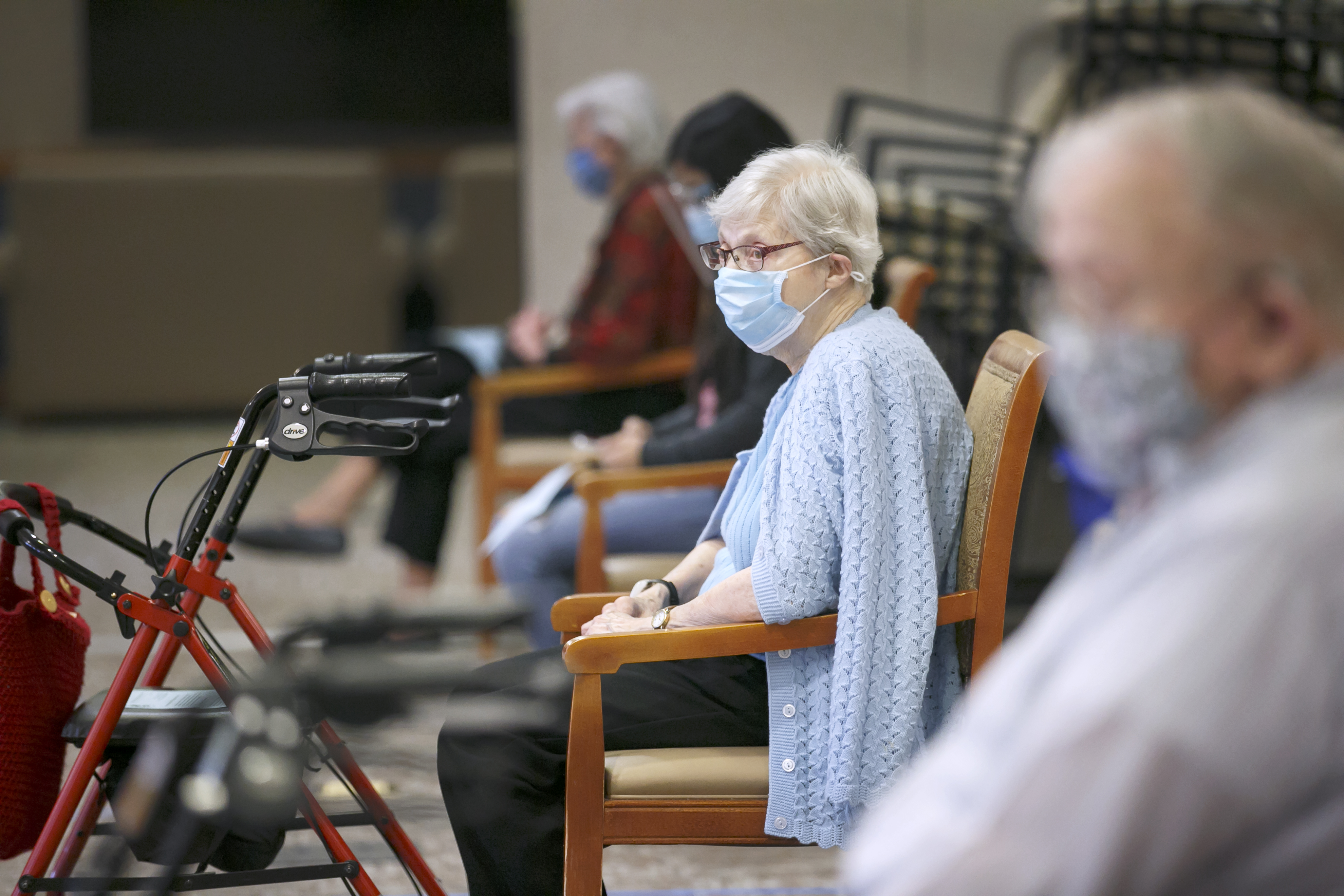 Friendsview Retirement Community resident Rozella Lever waits during the observation period after receiving a COVID-19 vaccination, Feb. 5, 2021 in Newberg, Ore.