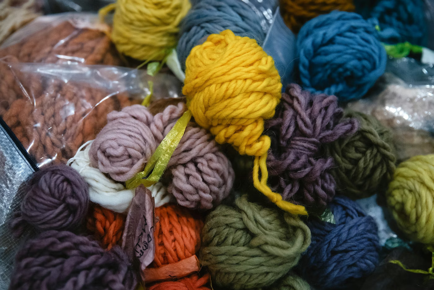 Various wools dyed with natural ingredients are displayed as student Sue Dixon sets up before a weaving class with instructor Susan Pavel on Saturday, March 7, 2026, at the Don Hatch Youth Center in Tulalip.