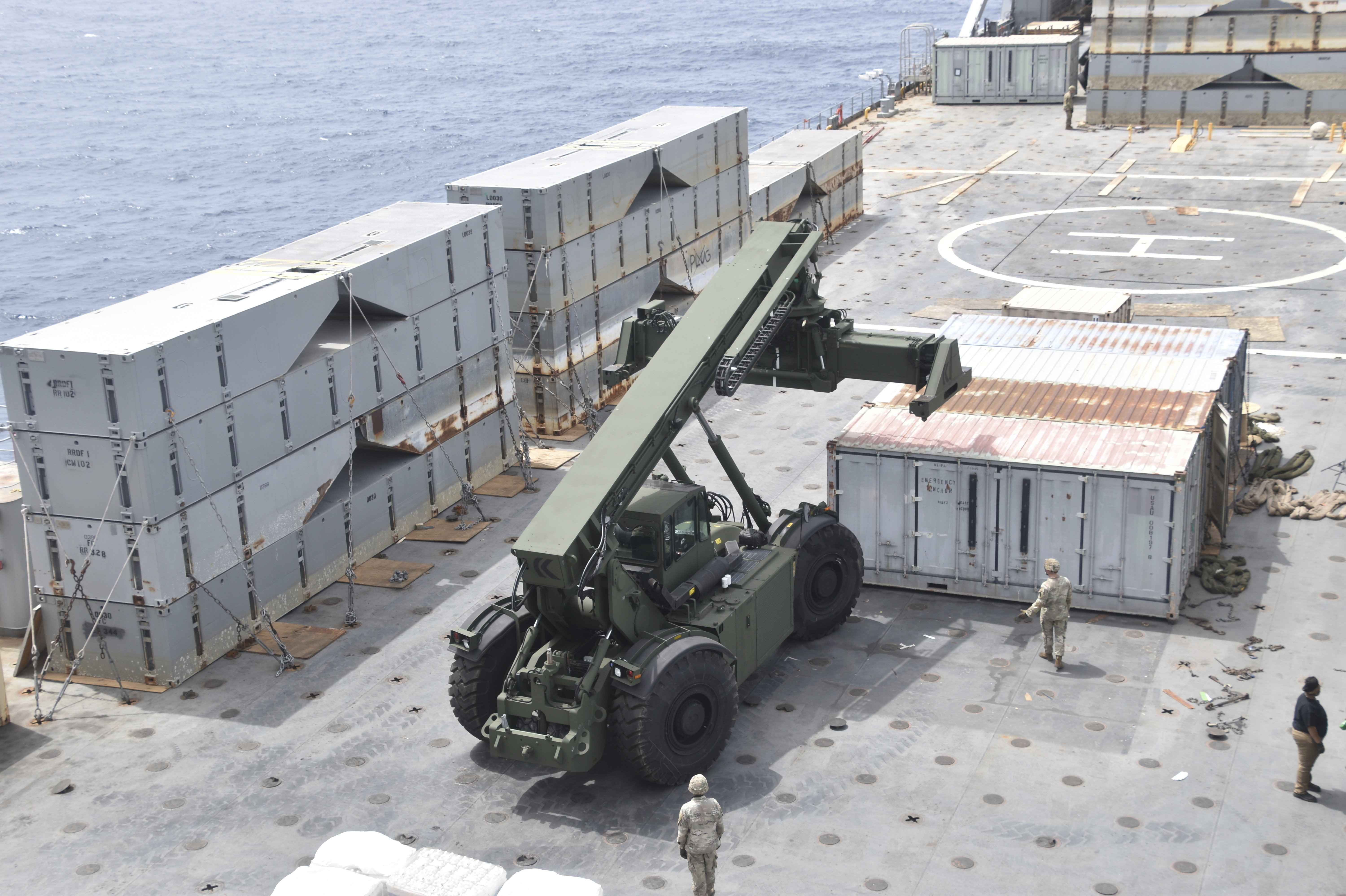 Soldiers assigned to the 7th Transportation Brigade and sailors attached to the MV Roy P. Benavidez assemble a floating pier off the shore of Gaza on April 26, 2024. The U.S. expects to have on-the-ground arrangements in Gaza ready for humanitarian workers to start delivering aid this month via a new U.S.-backed sea route.