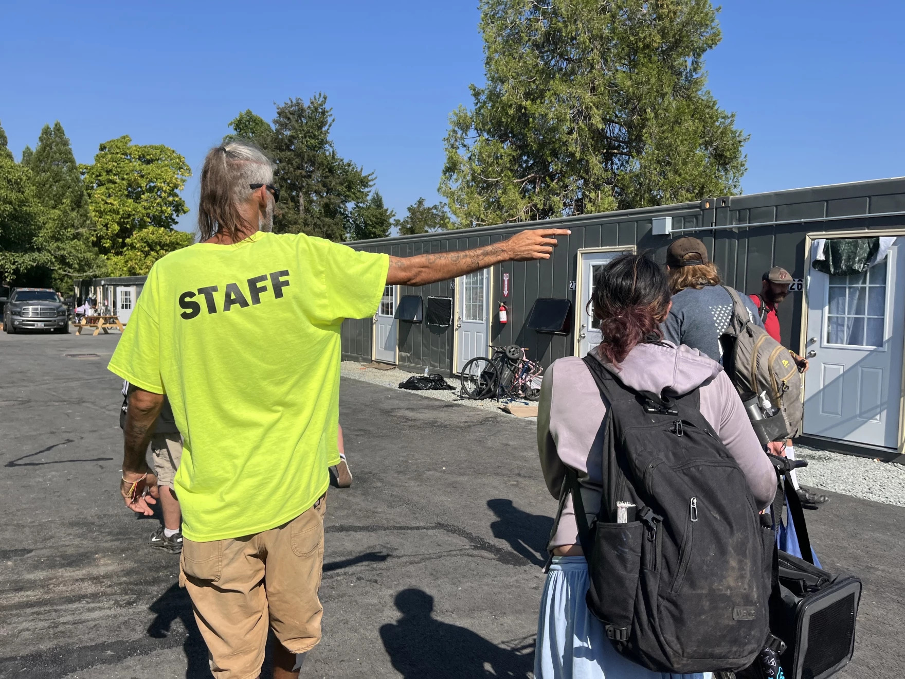 Gary Nichols gives new residents a tour of Parker's Place Village on Aug. 4, 2026.