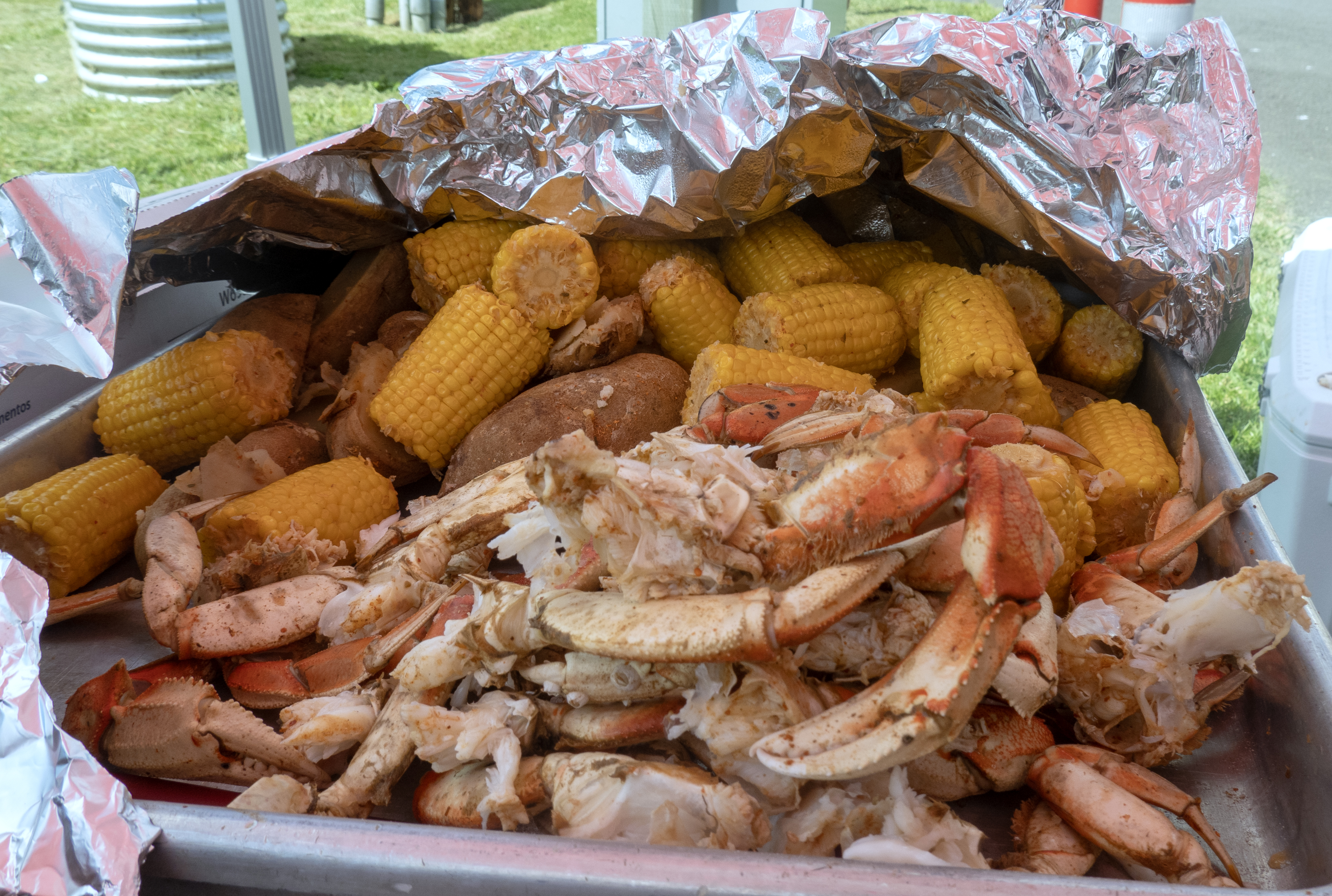 A tray of crab legs with corn on the cob and potatoes, cooked by the students in the seafood culinary class at Siletz Valley School, May 23, 2024. Through the High School Butchery program, students learn how to cook and fillet through hands-on demonstrations and workshops.