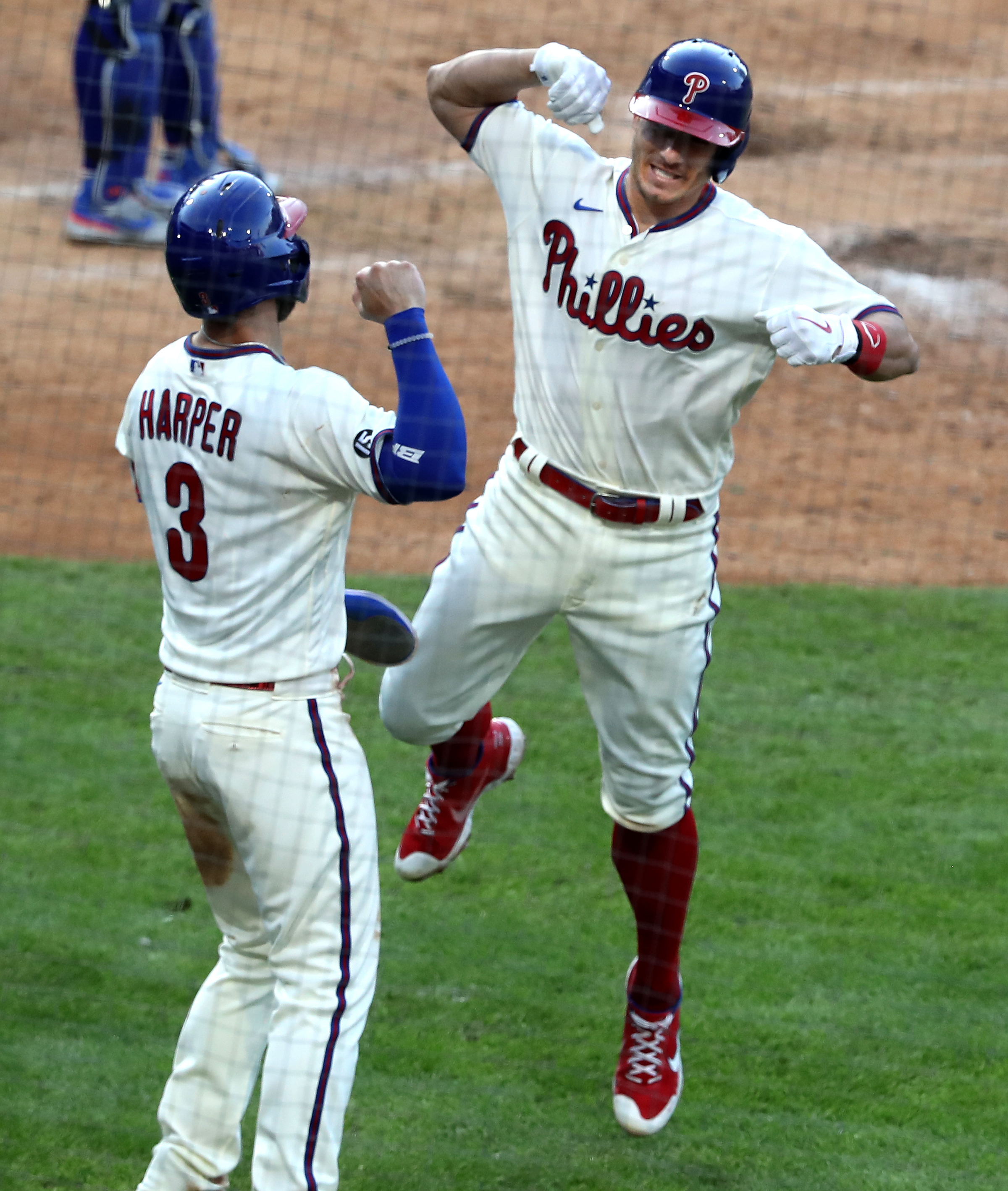 Philadelphia Phillies - J.T. Realmuto and Bryce Harper celebrating J.T.'s  home run.