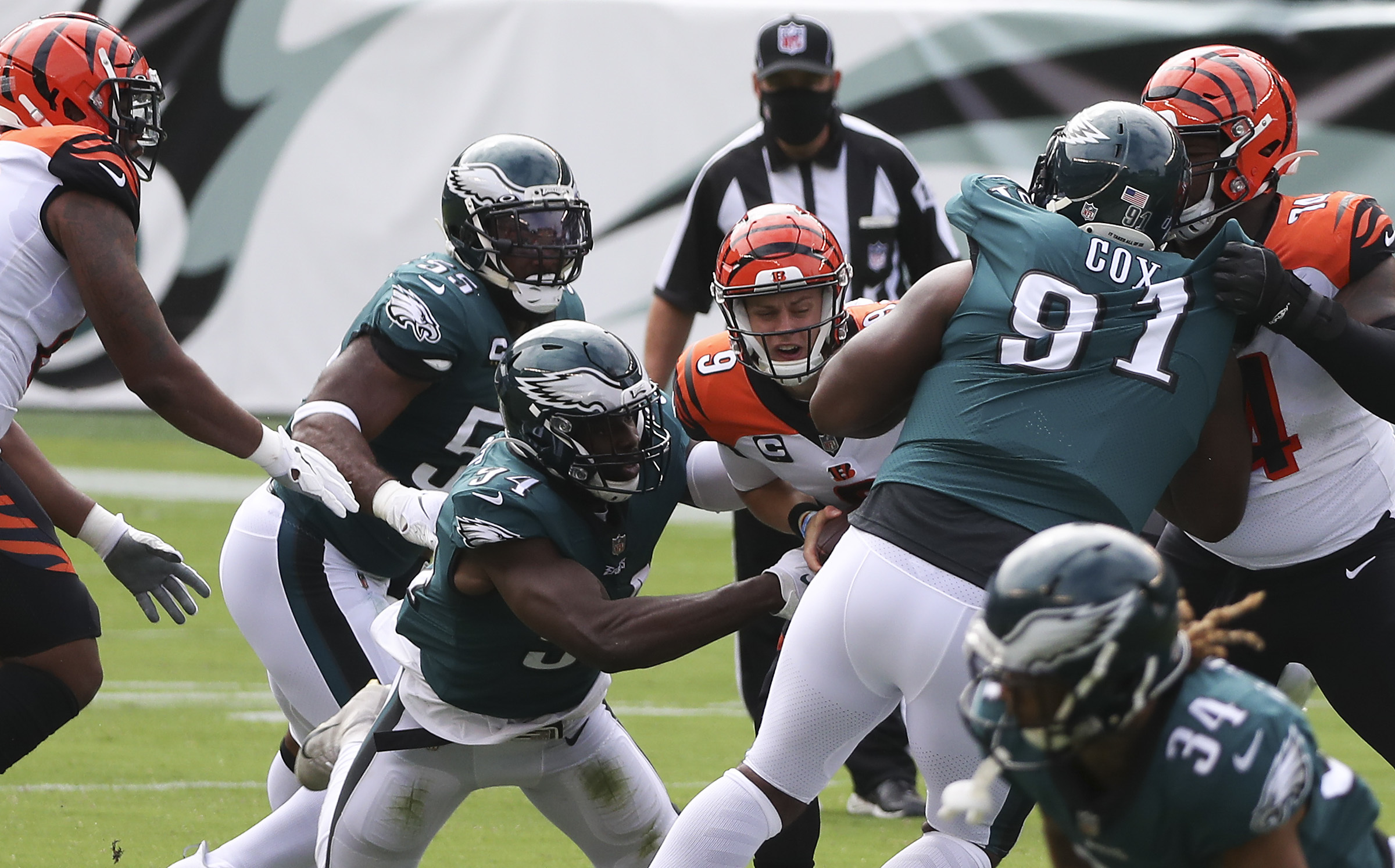 Philadelphia Eagles defensive end Fletcher Cox (91) and running back Corey  Clement (30) head out to