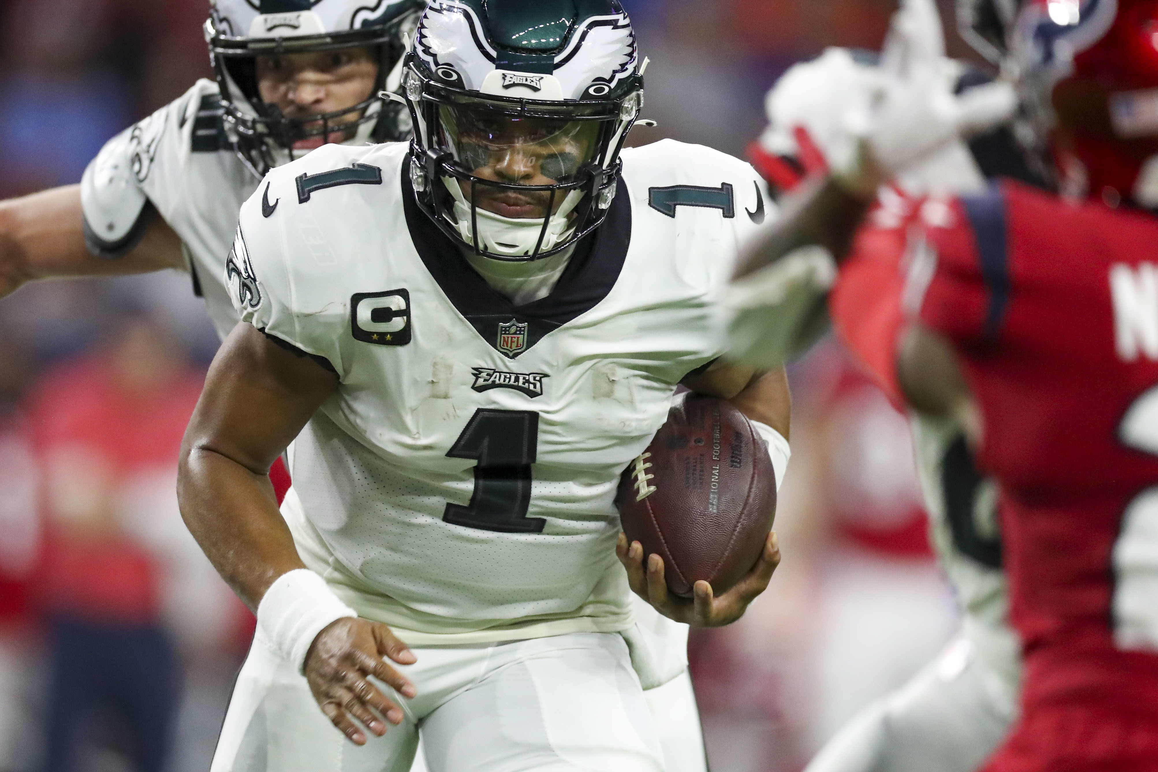 PHILADELPHIA, PA - NOVEMBER 14: Washington Commanders quarterback Carson  Wentz (11) and Philadelphia Eagles defensive end Brandon Graham (55) pray  after the game between the Washington Commanders and the Philadelphia Eagles  on