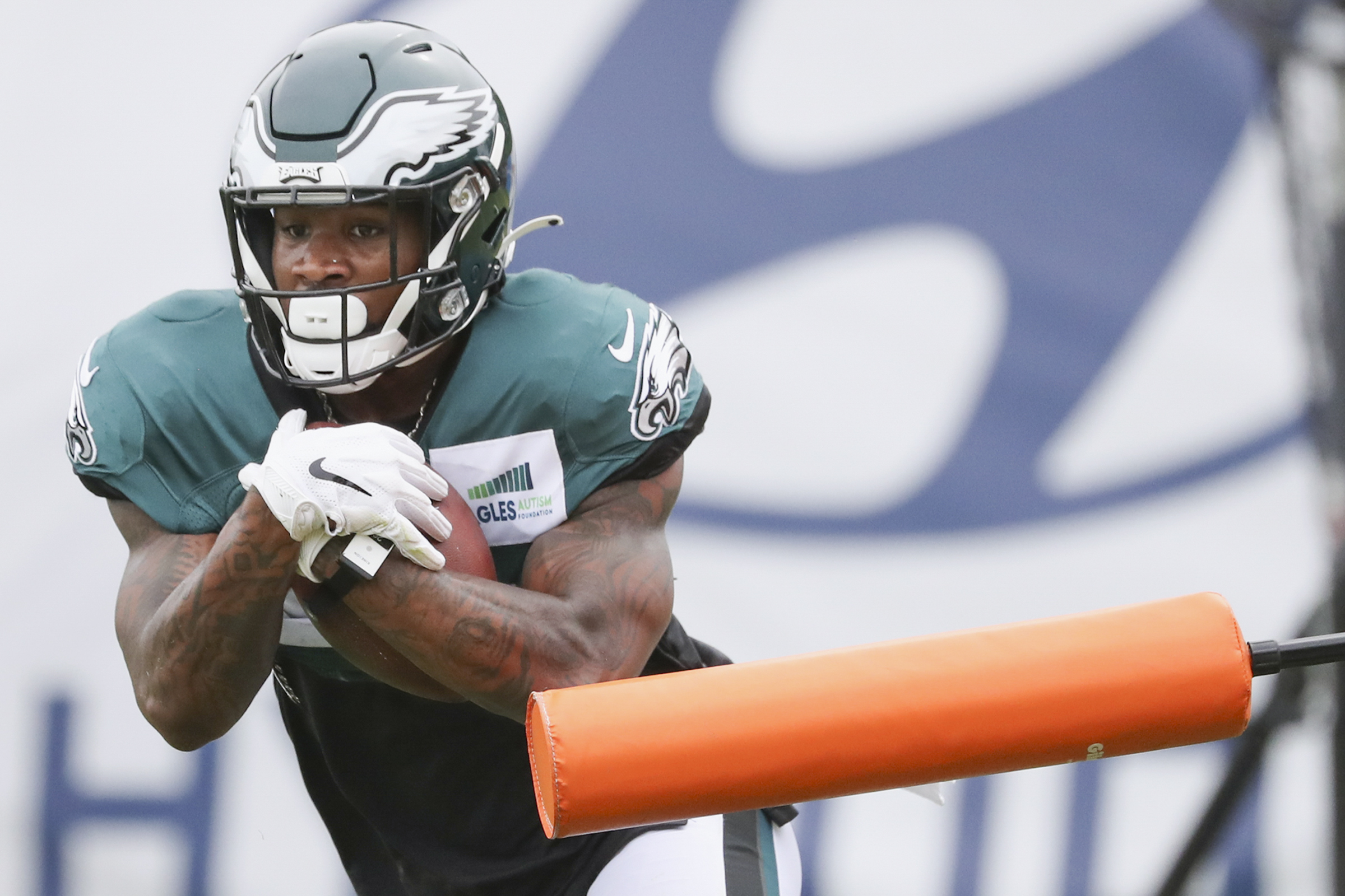 Eagles running back Miles Sanders (26) runs a drill during training camp at the NovaCare Complex in South Philadelphia on Tuesday, Aug. 3, 2021.