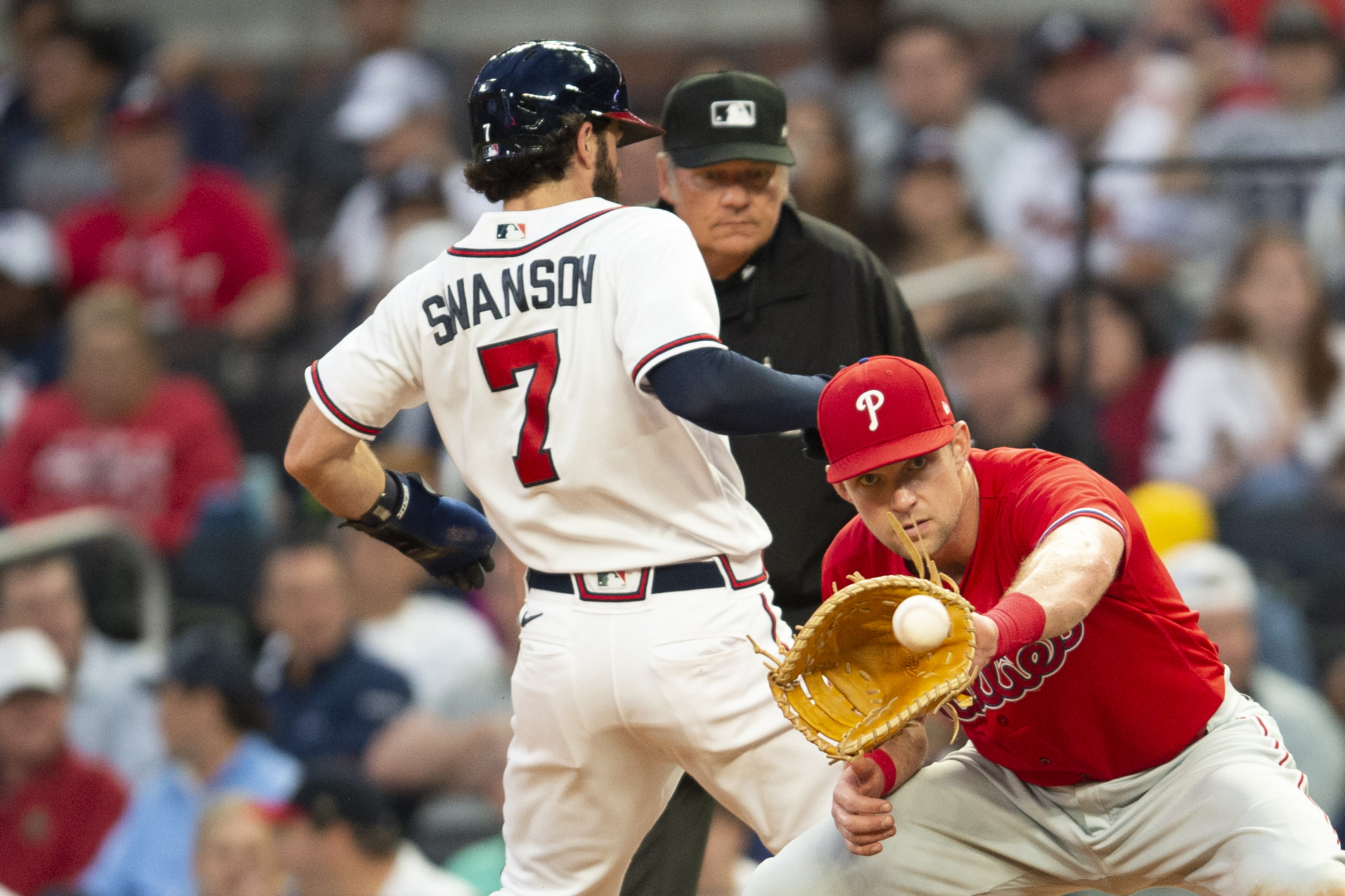 Philadelphia Phillies' Aaron Rowand, left, is congratulated by teammates  after scoring on a bases-loaded walk in the second inning of a baseball  game against the Atlanta Braves Tuesday, May 1, 2007, in