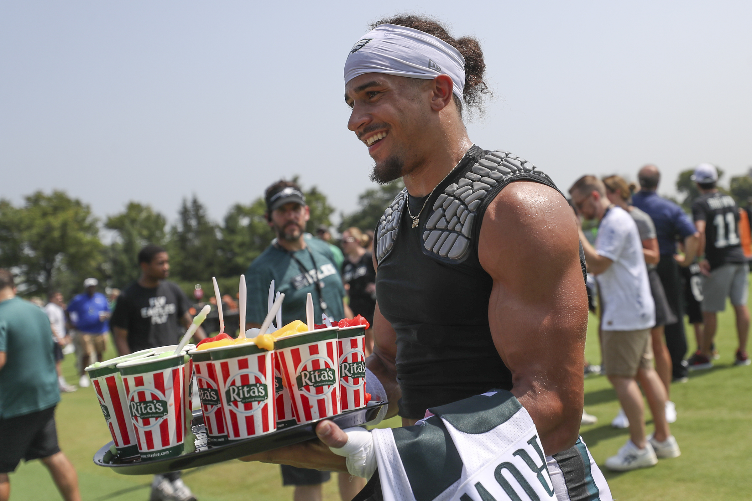 Philadelphia Eagles' Jalen Carter hands his jersey over to a member of the  Military during practice at NFL football training camp, Sunday, July 30,  2023, in Philadelphia. (AP Photo/Chris Szagola Stock Photo 