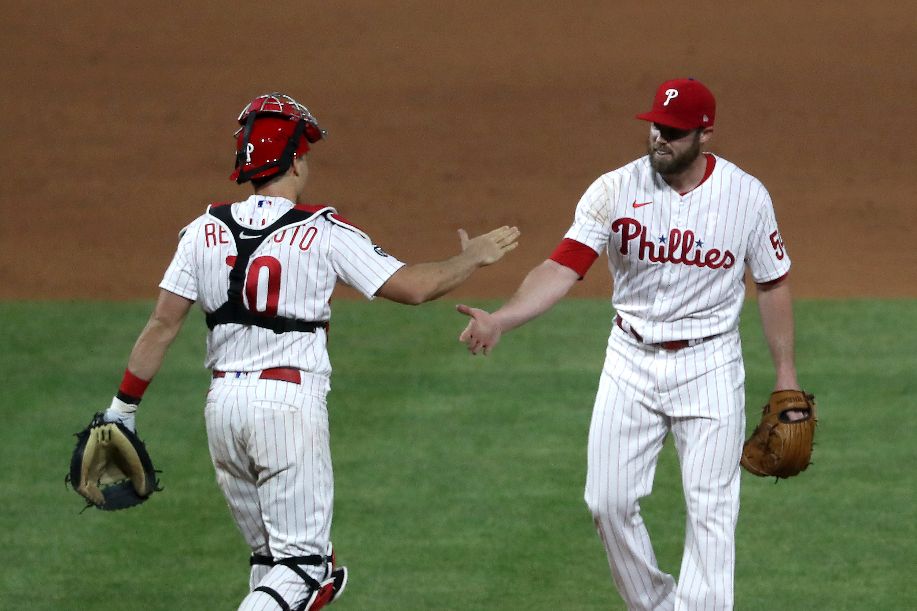 Philadelphia Phillies' Brad Miller is congratulated by his