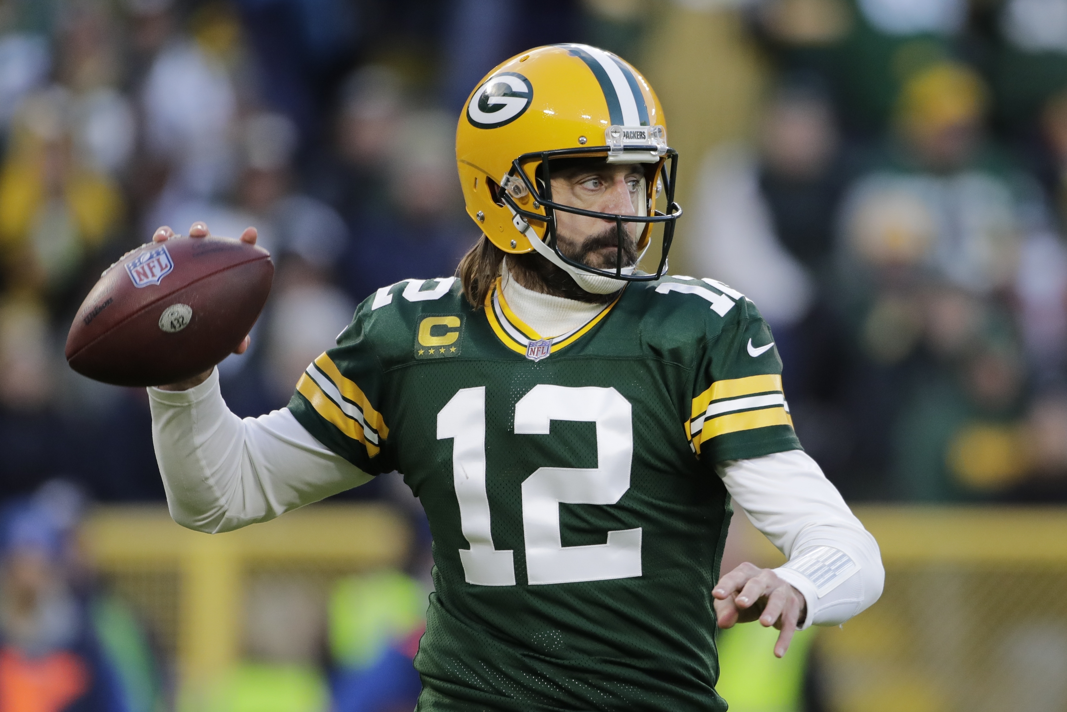 Green Bay Packers QB Aaron Rodgers, unmasked and still searching