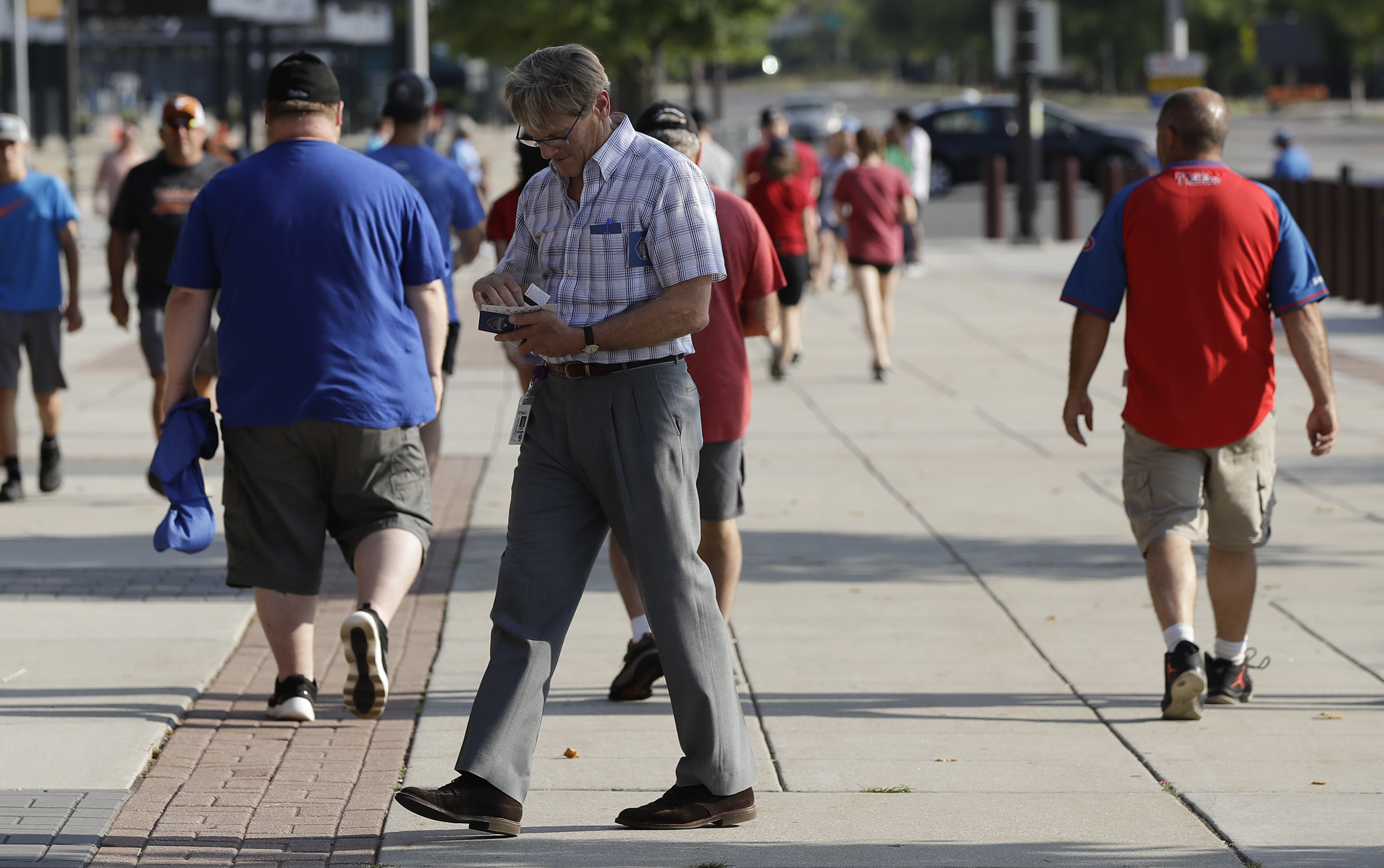 A person walks toward the Philadelphia Phillies team store at Citizens Bank  Park on Monday, Jul …