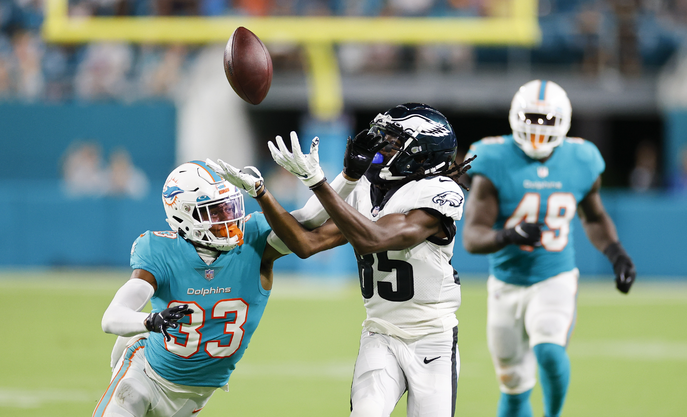 Miami Dolphins cornerback Elijah Hamilton (33) interferes with a