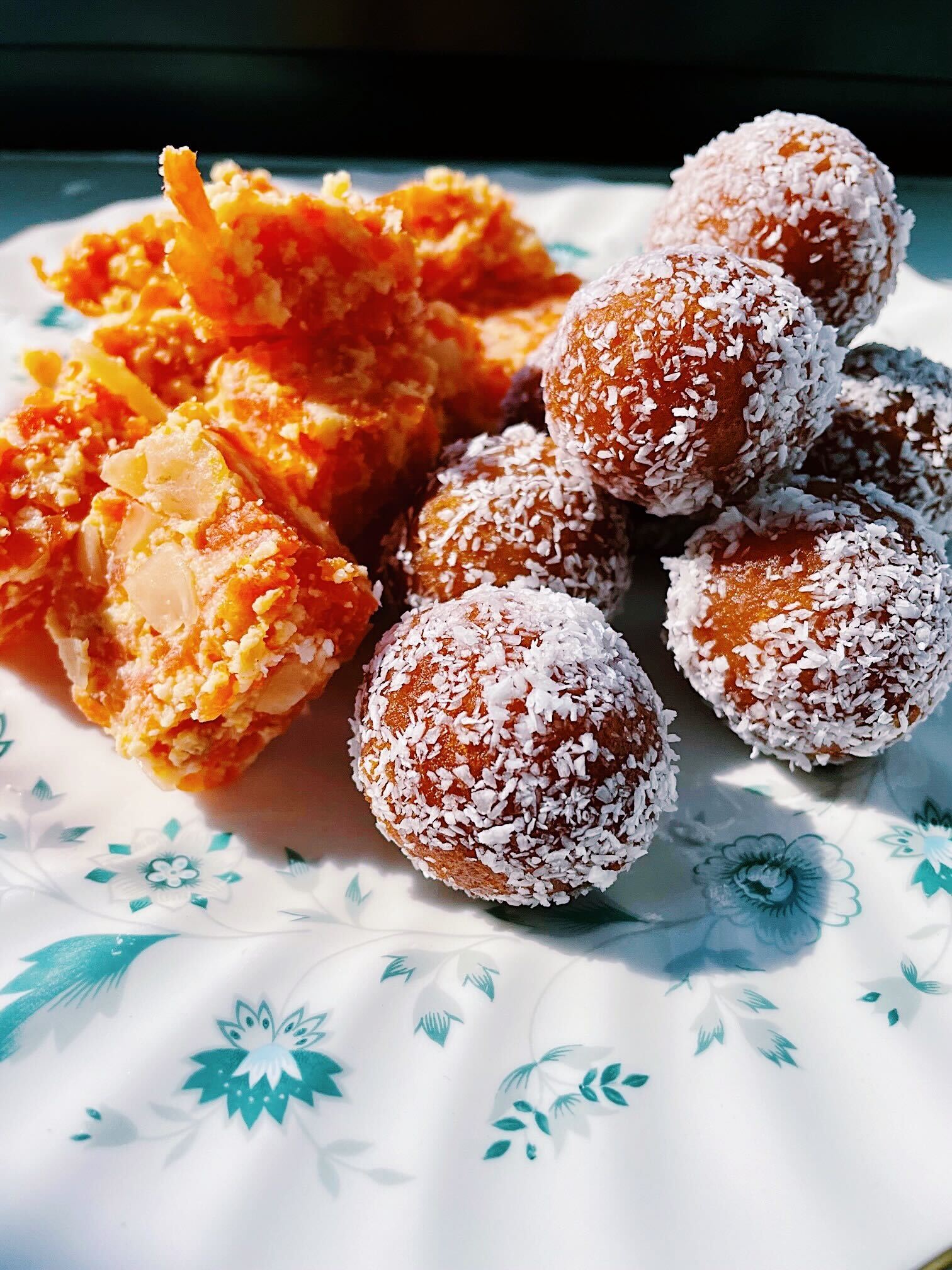 Gulab jamun and gajar ka halwa on a plate.