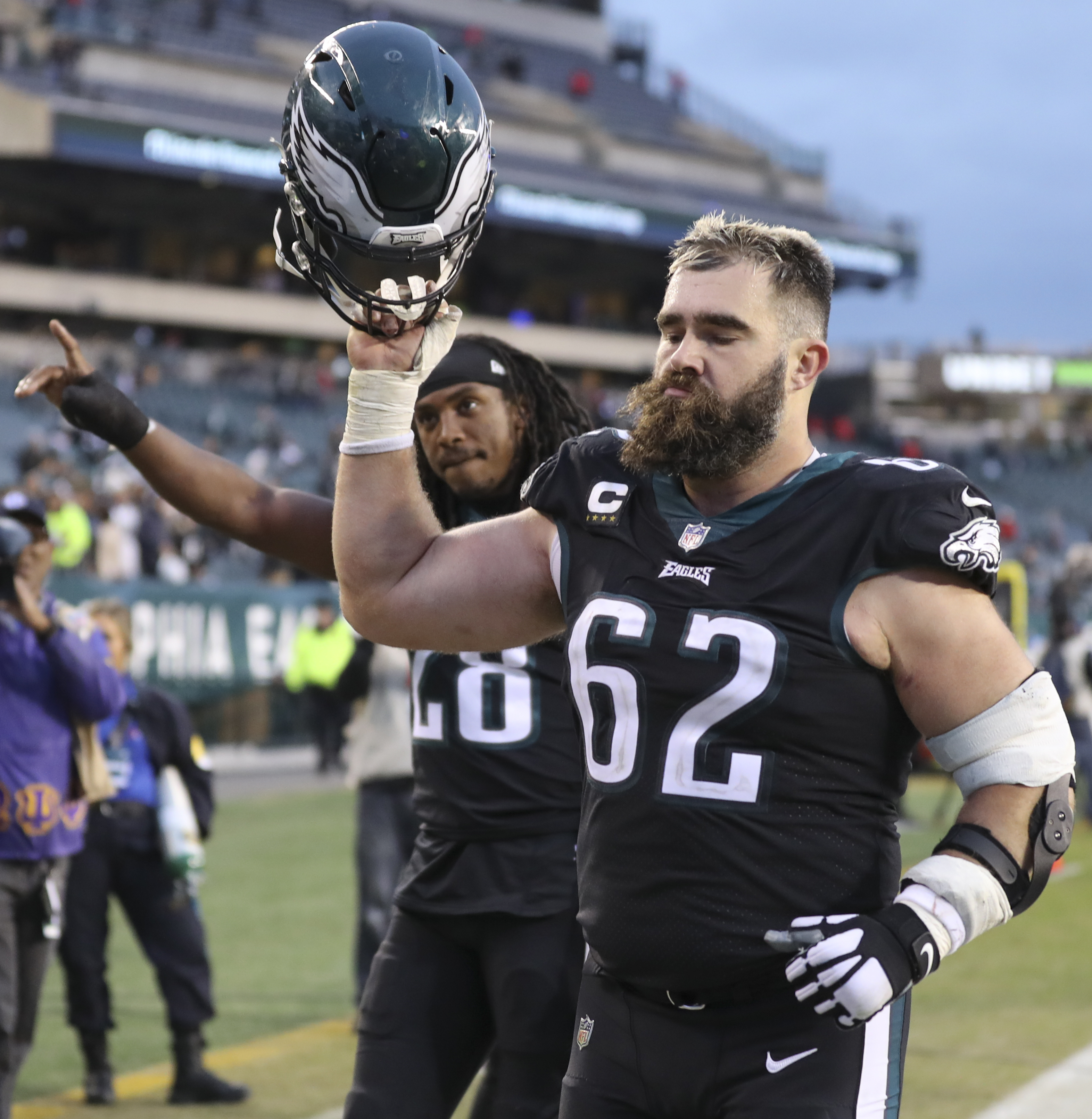 Philadelphia Eagles center Jason Kelce (62) adjusts his gear during  warm-ups prior to the NFL divisional round playoff football game against  the New York Giants, Saturday, Jan. 21, 2023, in Philadelphia. (AP