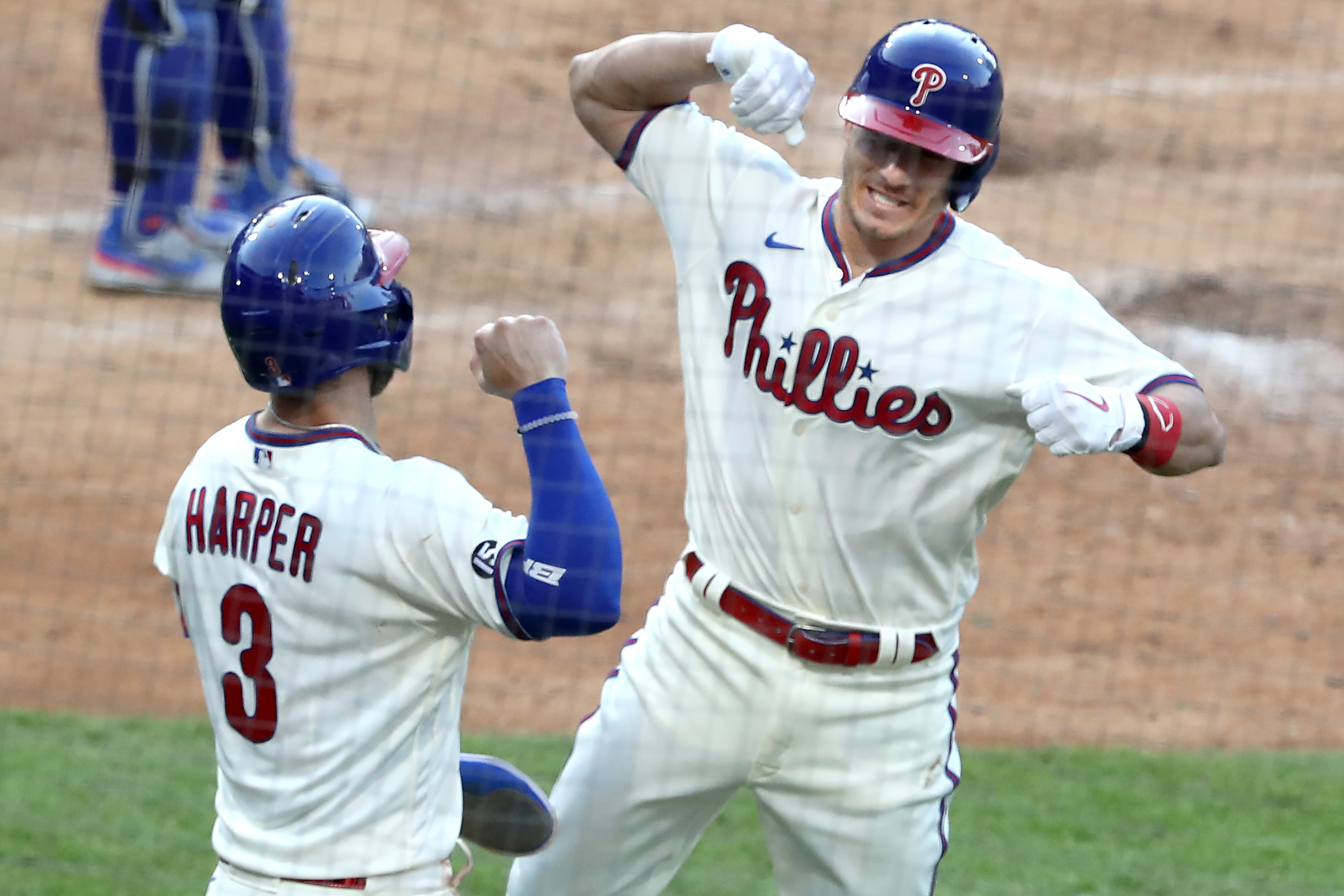 Philadelphia Phillies - J.T. Realmuto and Bryce Harper celebrating J.T.'s  home run.