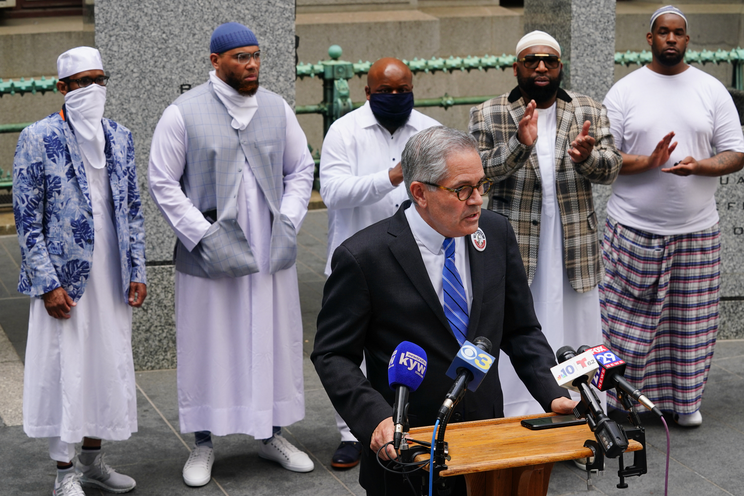 Krasner outside City Hall on May 4 with a group of men exonerated of wrongful murder convictions. From left to right behind him are Theophalis Bilal Wilson, Terrance Lewis, Jimmy Dennis, Anthony Wright, and Tony Wright Jr.