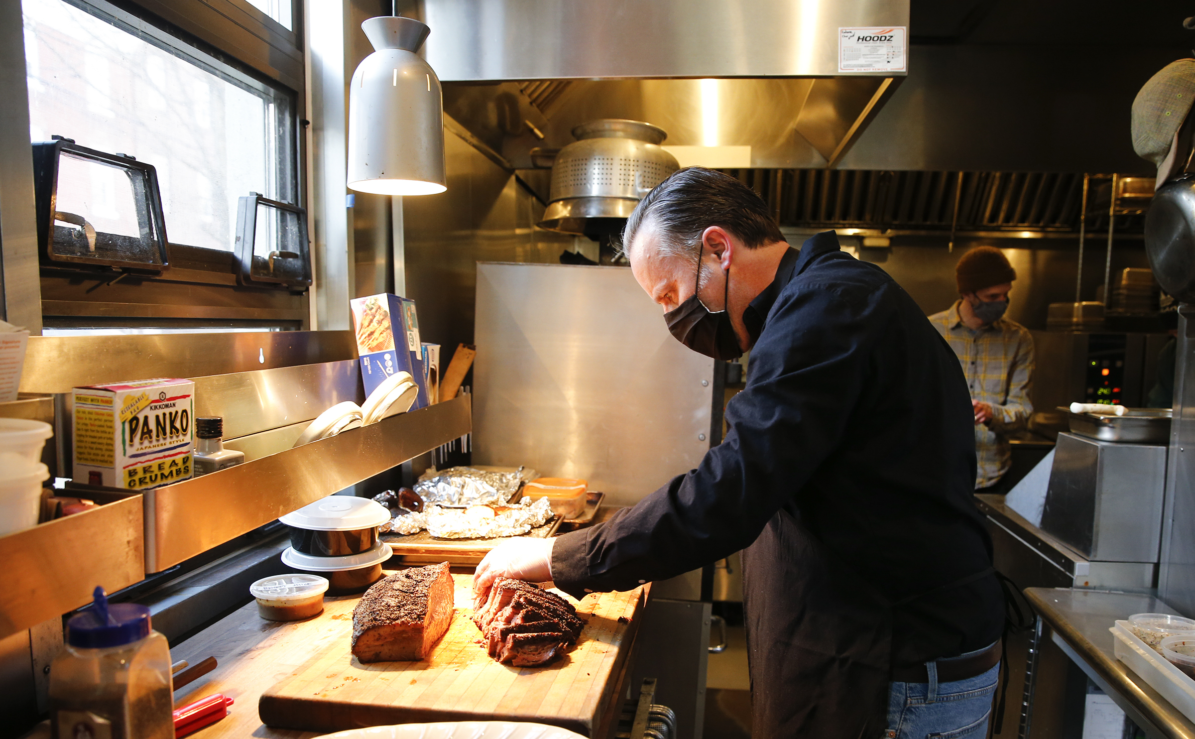 Scott Hanson slices a Central Texas Style Smoked Brisket at Cadence Restaurant in the Fishtown section of Philadelphia on Monday, March 15, 2021. Hanson, a Texas barbecue pitmaster is opening pop-up with a Tex-Mex twist at Cadence in Fishtown.