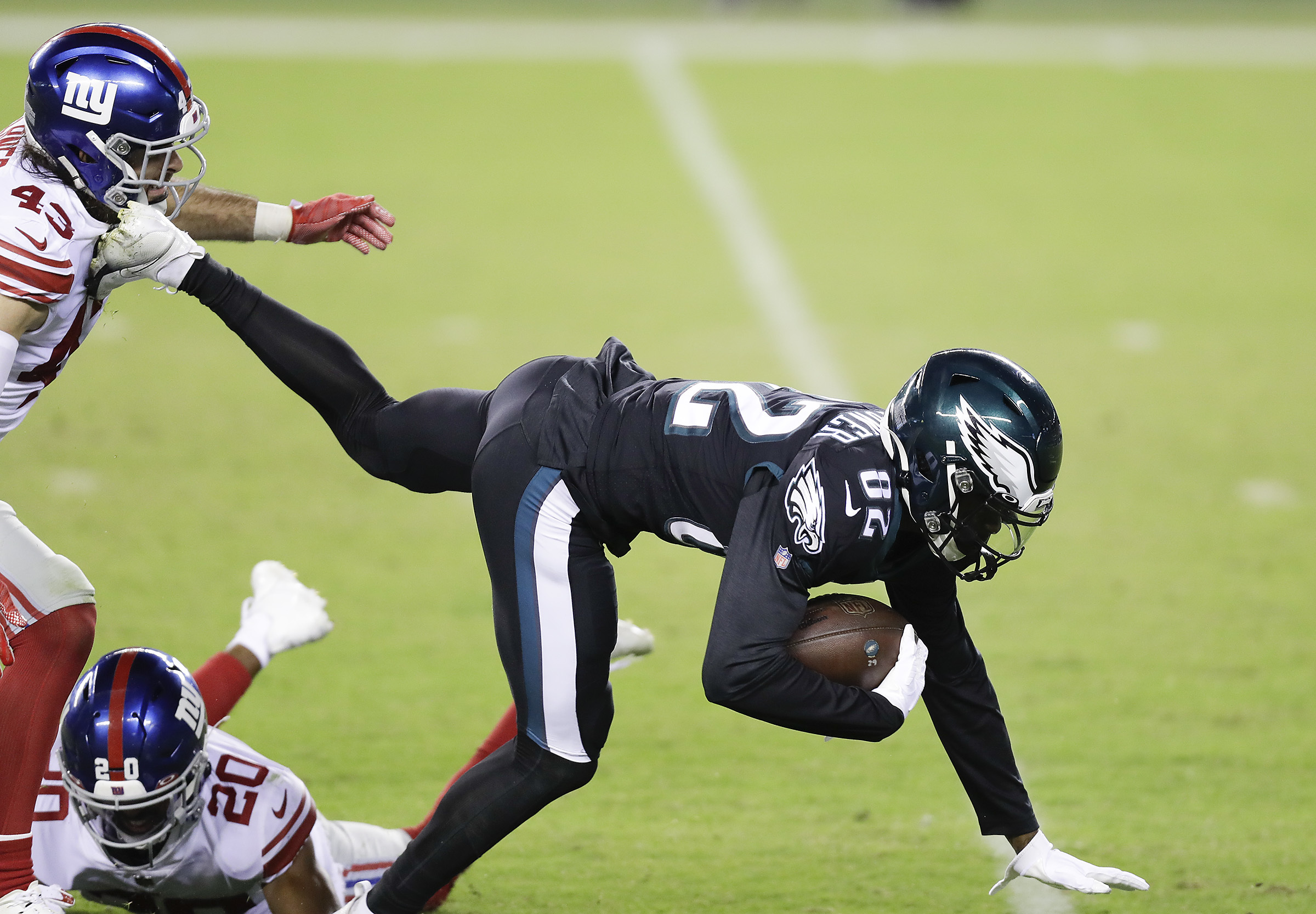 New York Giants safety Julian Love (20) runs up the field during an NFL  football game against the Philadelphia Eagles, Sunday, Nov. 28, 2021, in  East Rutherford, N.J. The New York Giants