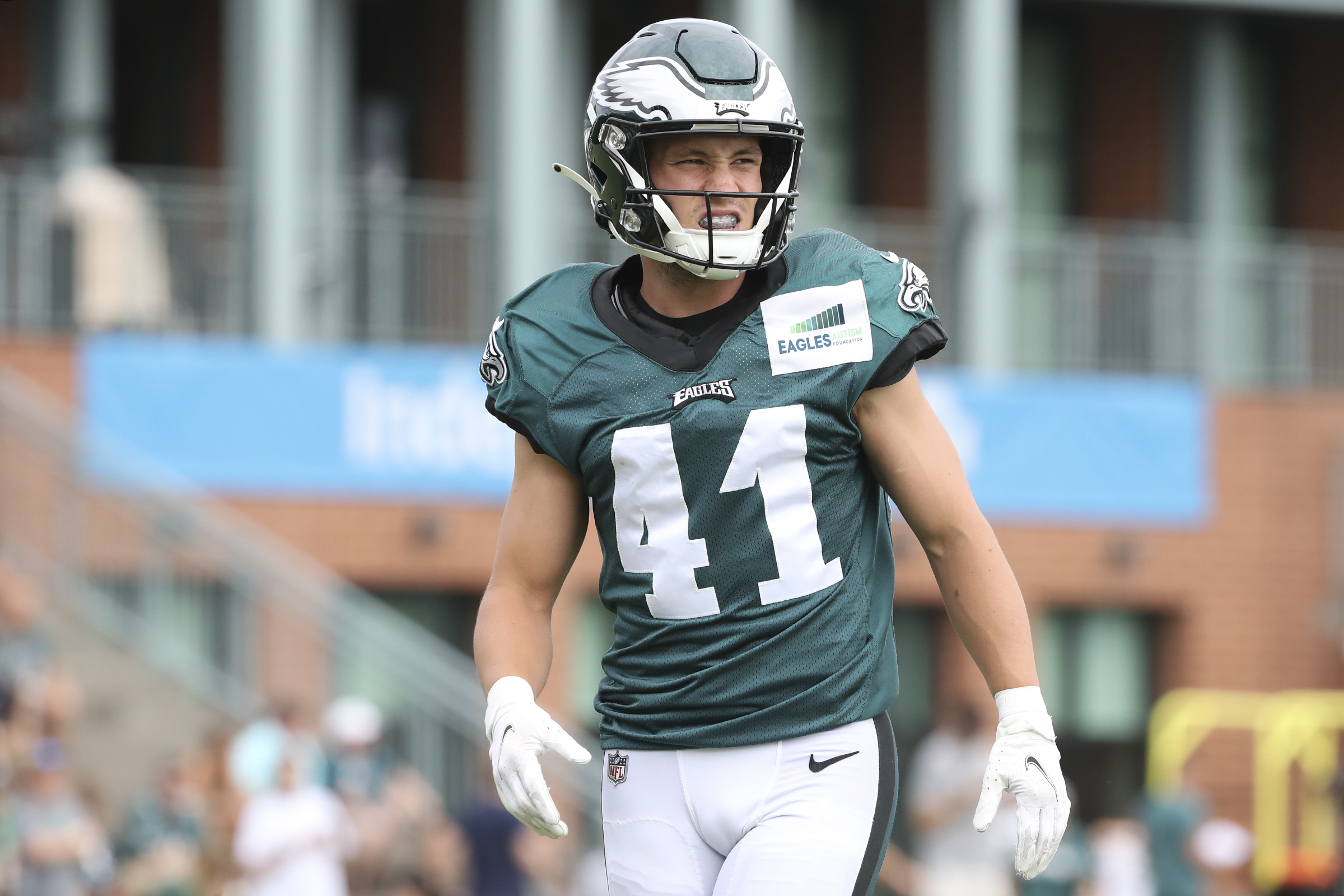 Member of the US military holds up the signed practice worm jersey of  Philadelphia Eagles quarterback Jalen Hurts for the Back Together  Saturday during practice at NFL football training camp, Saturday, July