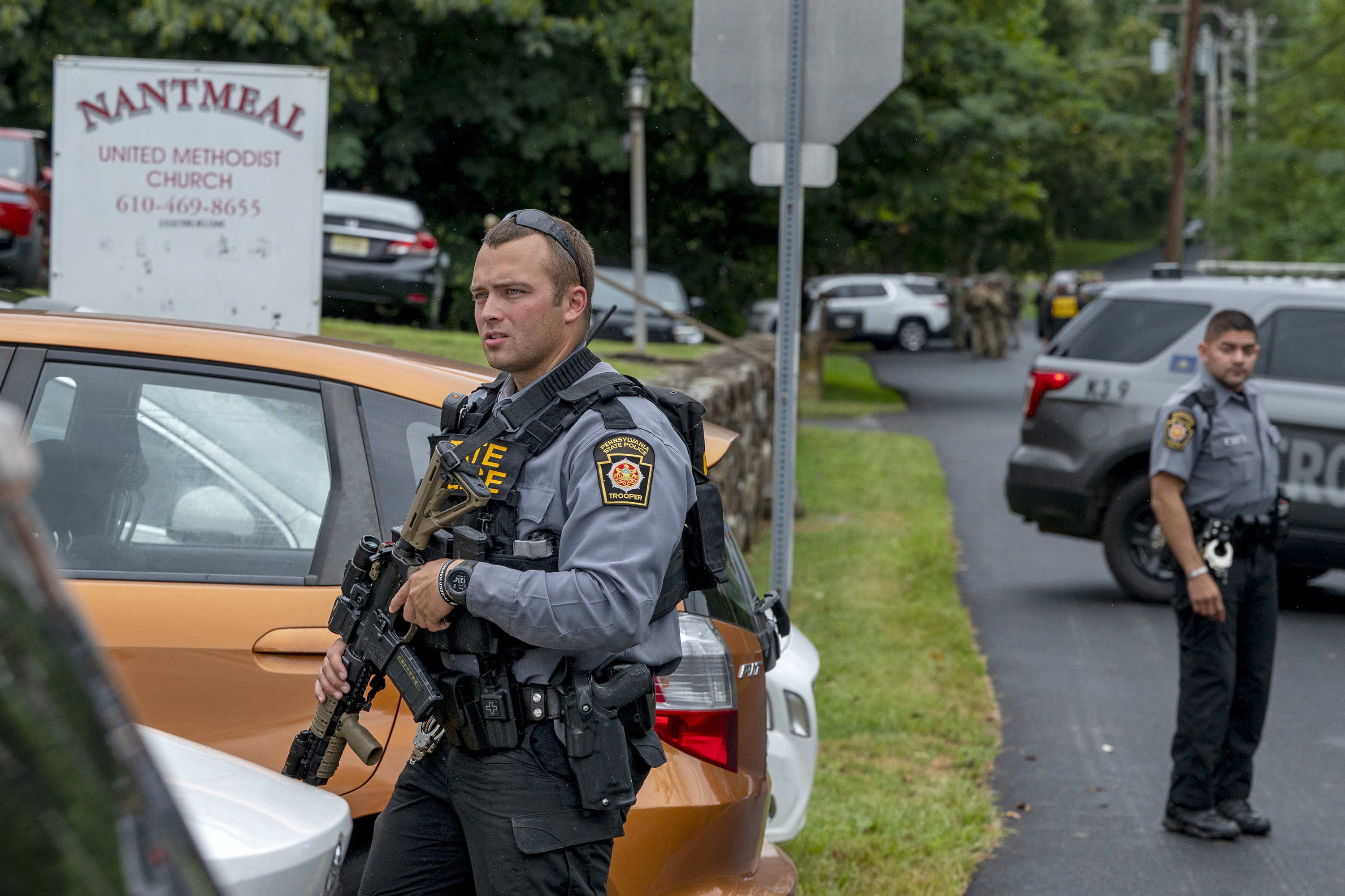 Heavily armed law enforcement officers move along Rt. 52 as the search  continues for Danilo Cavalcante in Pocopson Township, Pa., on Sunday, Sept.  3, 2023. Cavalcante escaped from the Chester County Prison.