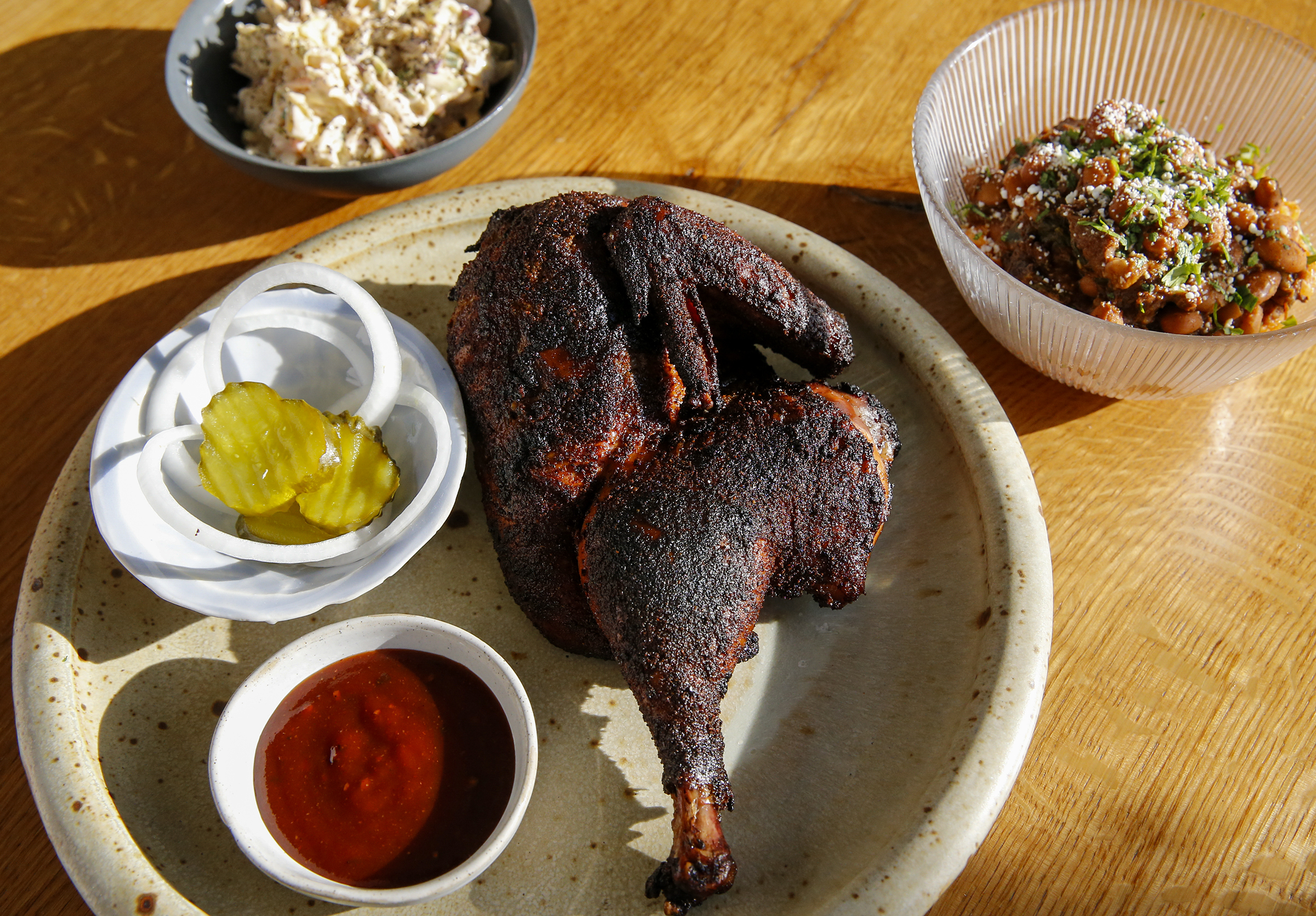 Smoked half chicken prepared by Scott Hanson at Cadence in the Fishtown on Monday, March 15, 2021. Hanson, a Texas barbecue pit master is opening North By Texas BBQ, a pop-up with a Tex-Mex twist.