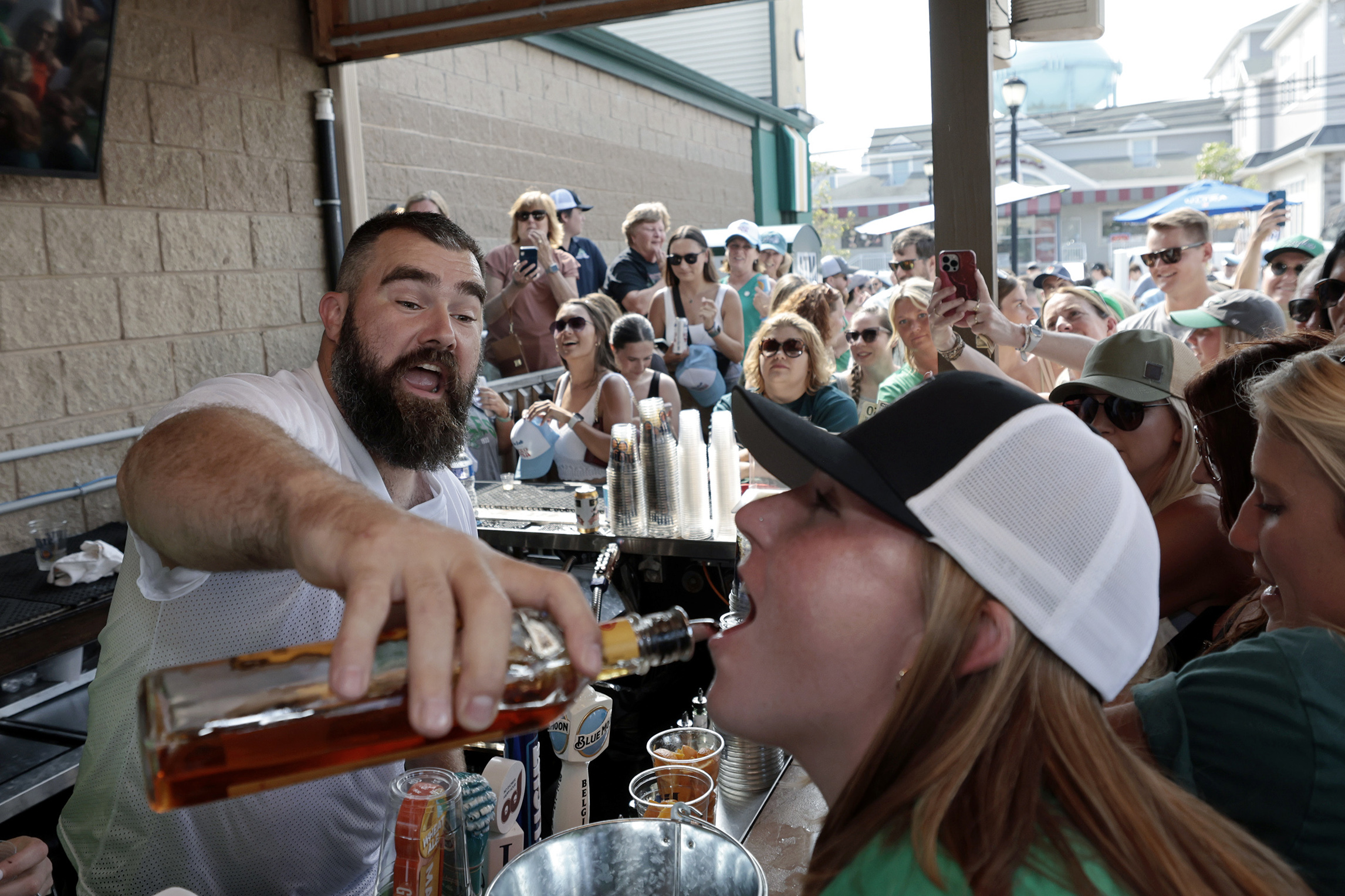 Why was Chiefs star Travis Kelce wearing an Eagles jersey and drinking beer  on Monday Night Football?