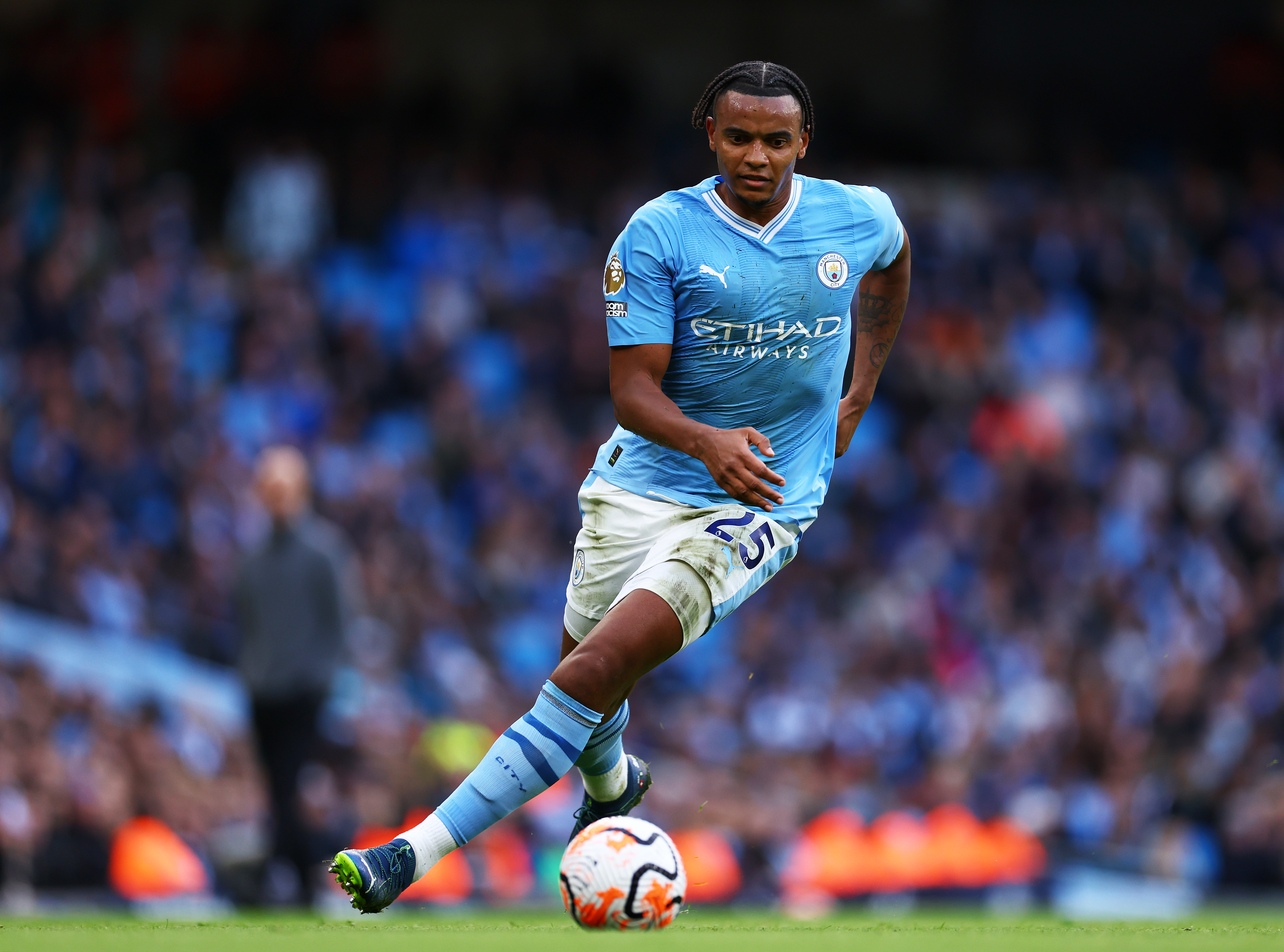 Manchester City's Manuel Akanji heads the ball during the