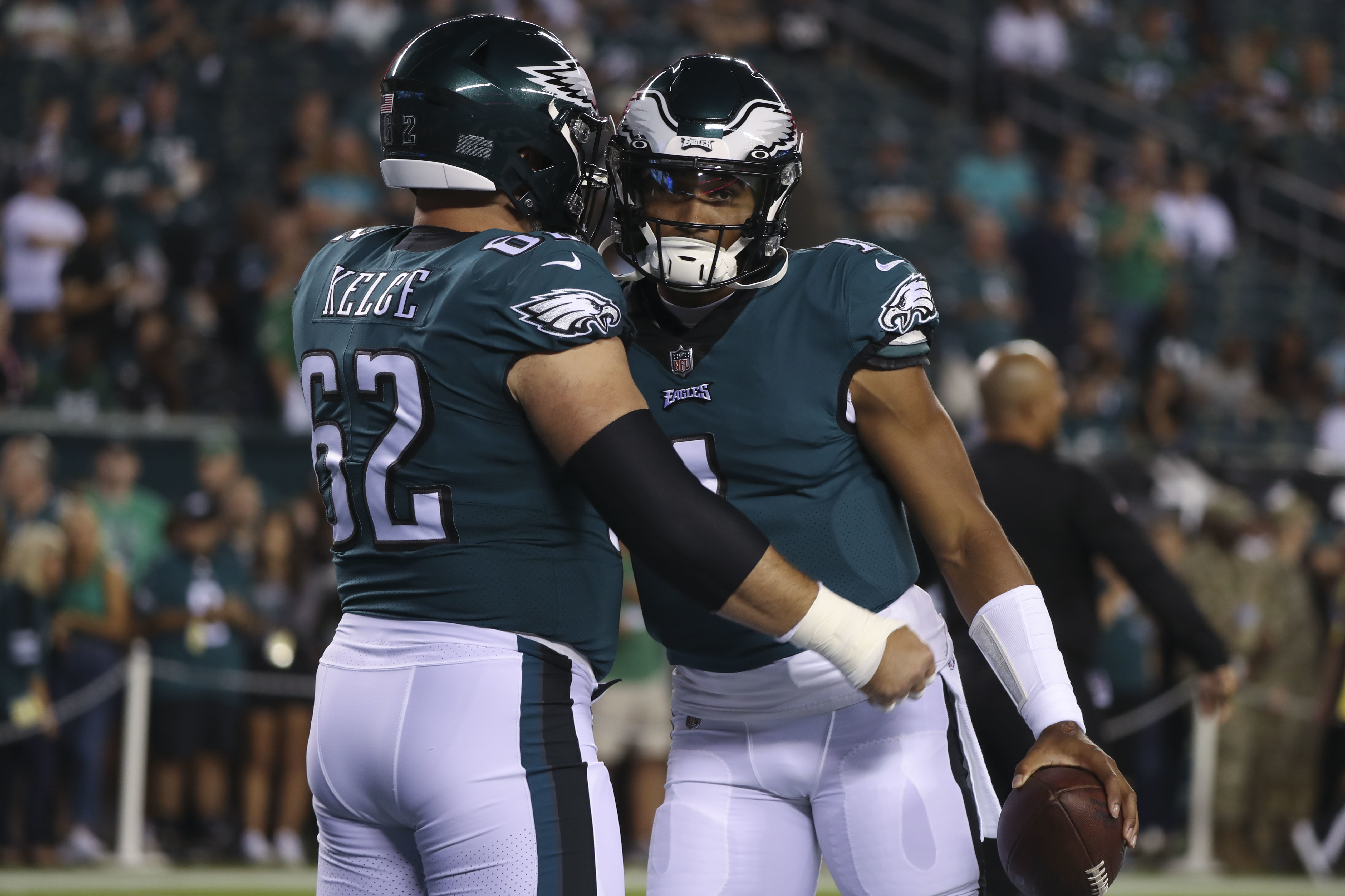 Chicago, United States. 18th Dec, 2022. Philadelphia Eagles quarterback  Jalen Hurts (1) hands off the ball to Philadelphia Eagles running back  Miles Sanders (26) during a game against the Chicago Bears at