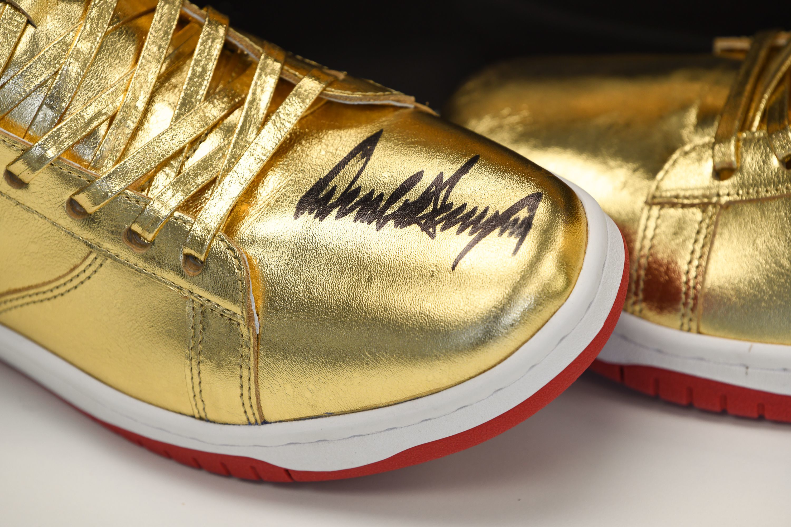 Autographed Trump sneakers were snapped up by Roman Sharf 