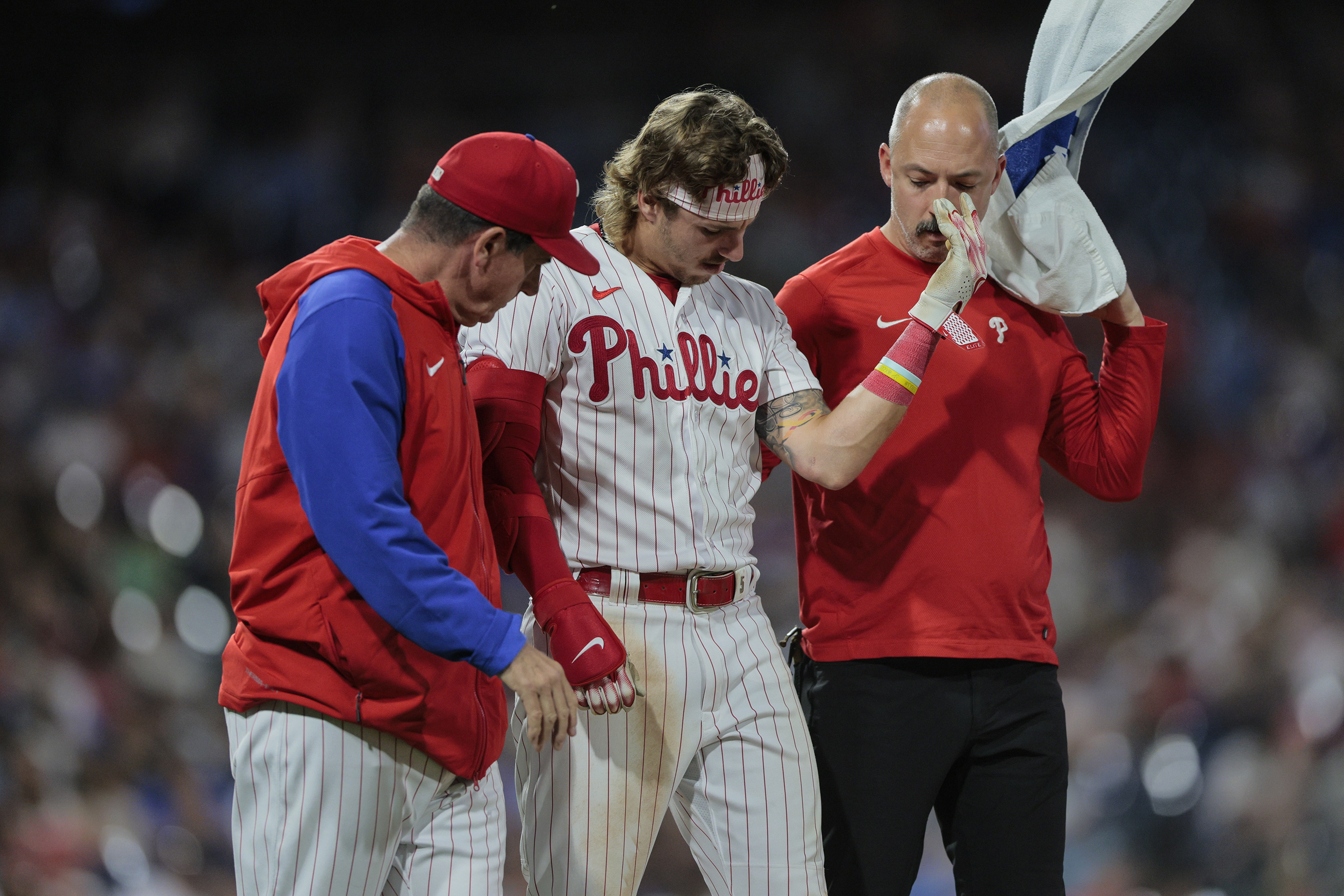 Phillies 'relieved' Bryson Stott OK after taking pitch to elbow; tight back  keeps Bryce Harper at DH