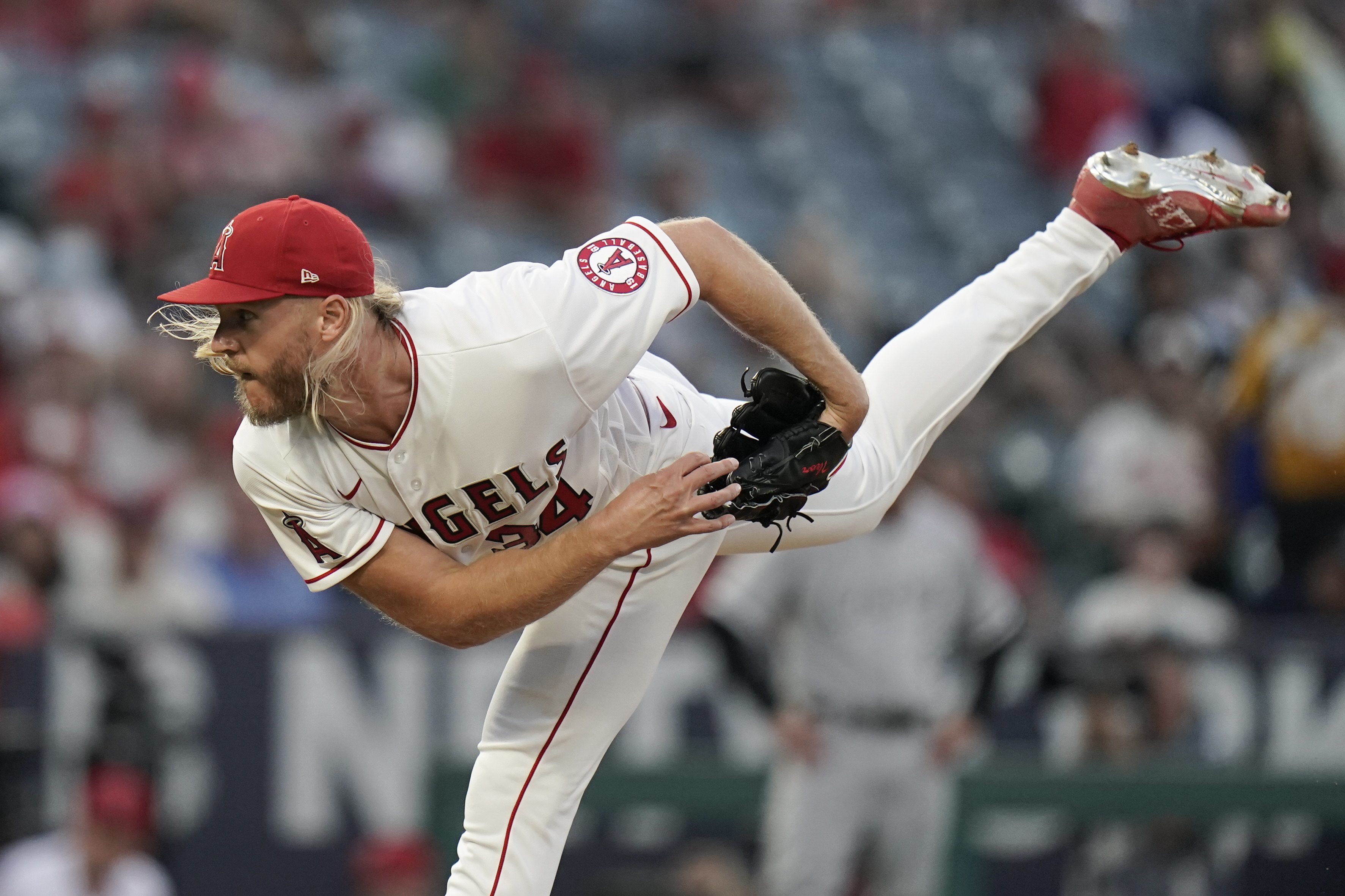 Philadelphia Phillies acquire pitcher Noah Syndergaard and outfielder  Brandon Marsh from the Los Angeles Angels, closer David Robertson from  Chicago Cubs
