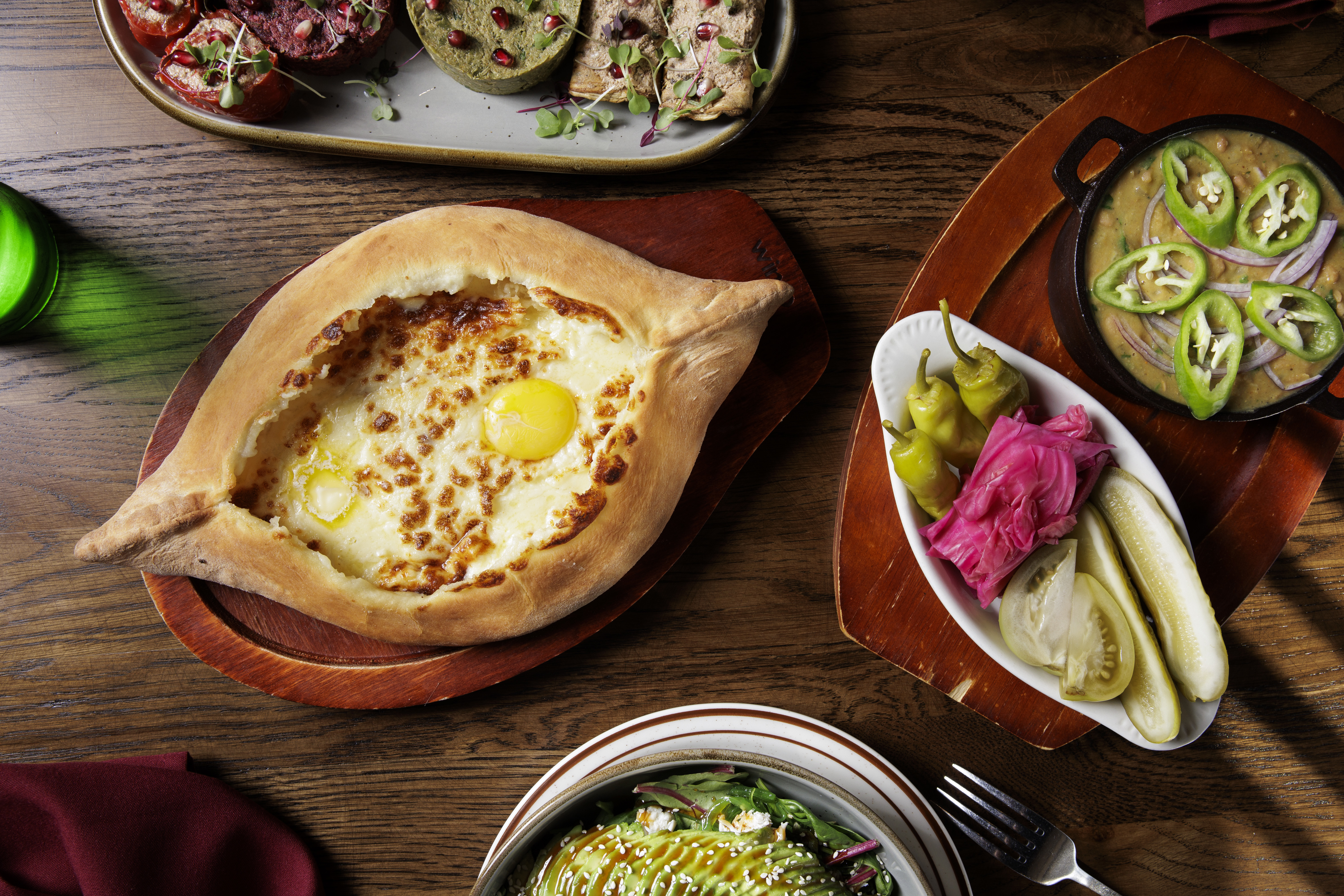 The Khachapuri 'Ajaruli' and Lobio at Gamarjoba in Philadelphia on Tuesday, Sept. 10, 2024. Food Styling by Emilie Fosnocht