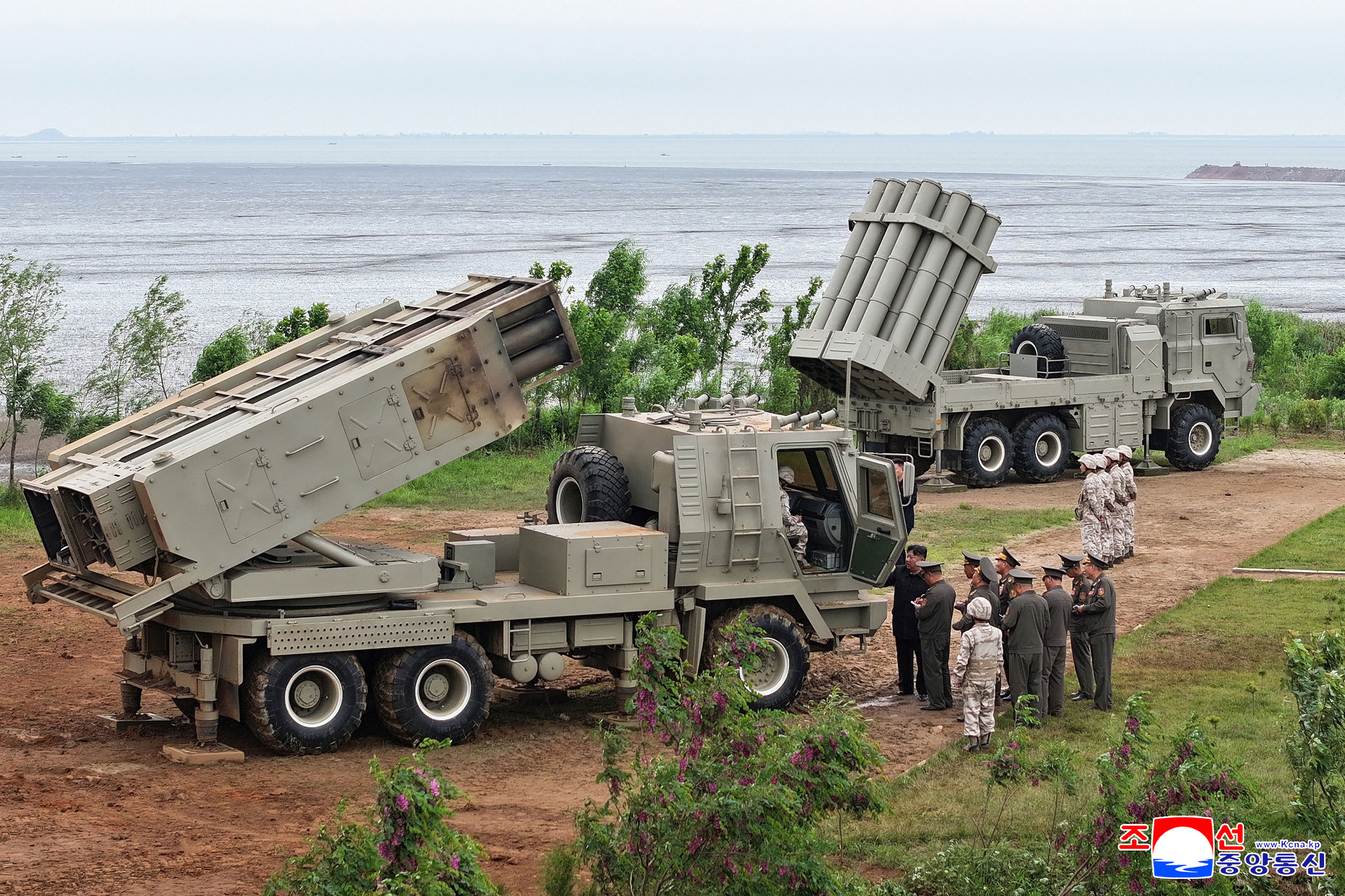 This picture taken on May 26, 2026 and released by North Korea's official Korean Central News Agency (KCNA) on May 27, 2026 shows North Korean leader Kim Jong Un inspecting tests of a newly-developed lightweight multi-purpose missile launching system and a multiple tactical cruise missile weapon system conducted by the Missile Administration and the Academy of Defense Sciences at an undisclosed location in North Korea.