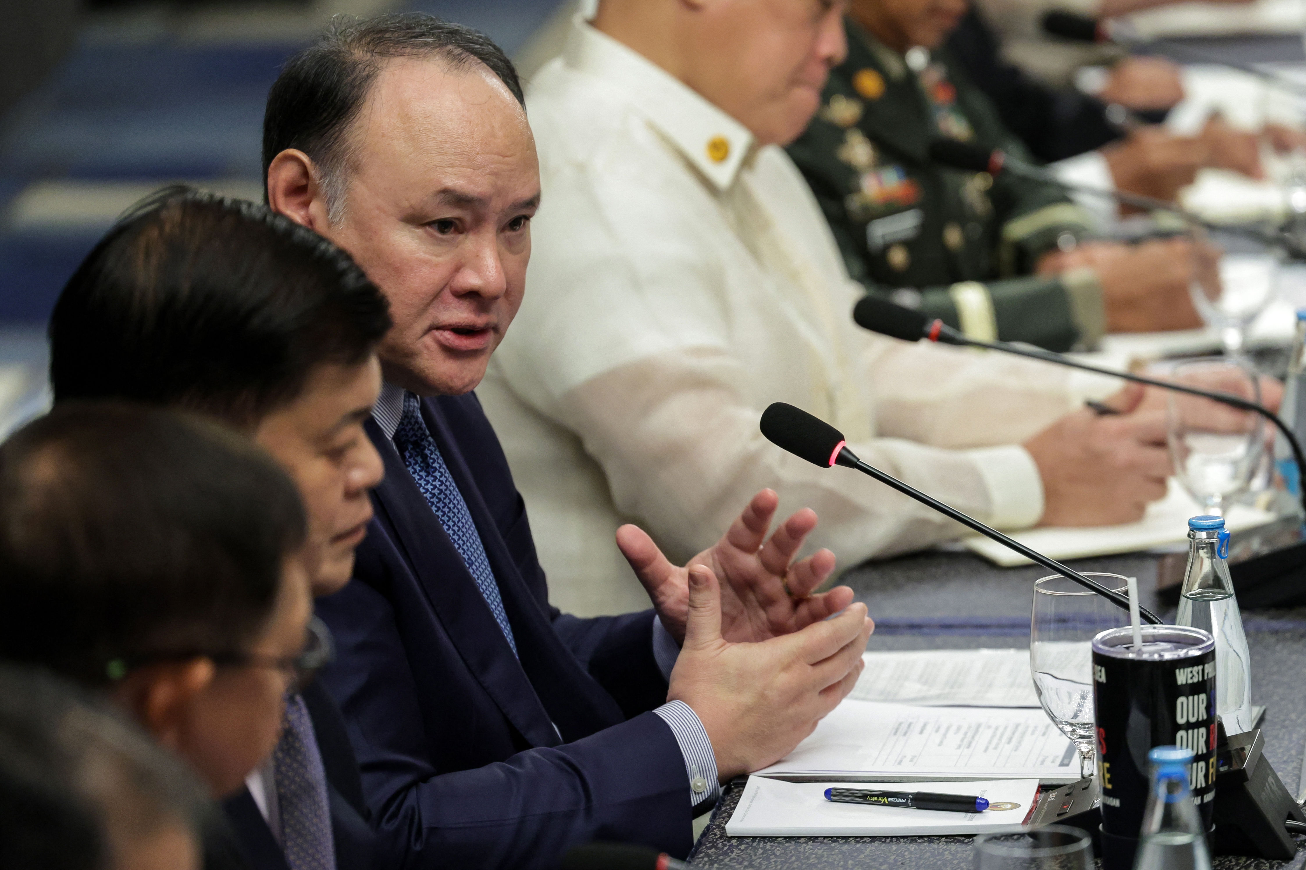 Philippines' Defense Secretary Gilbert Teodoro Jr., center, speaks during a bilateral meeting with Japan's Defense Minister Shinjiro Koizumi in Manila, May 5, 2026.
