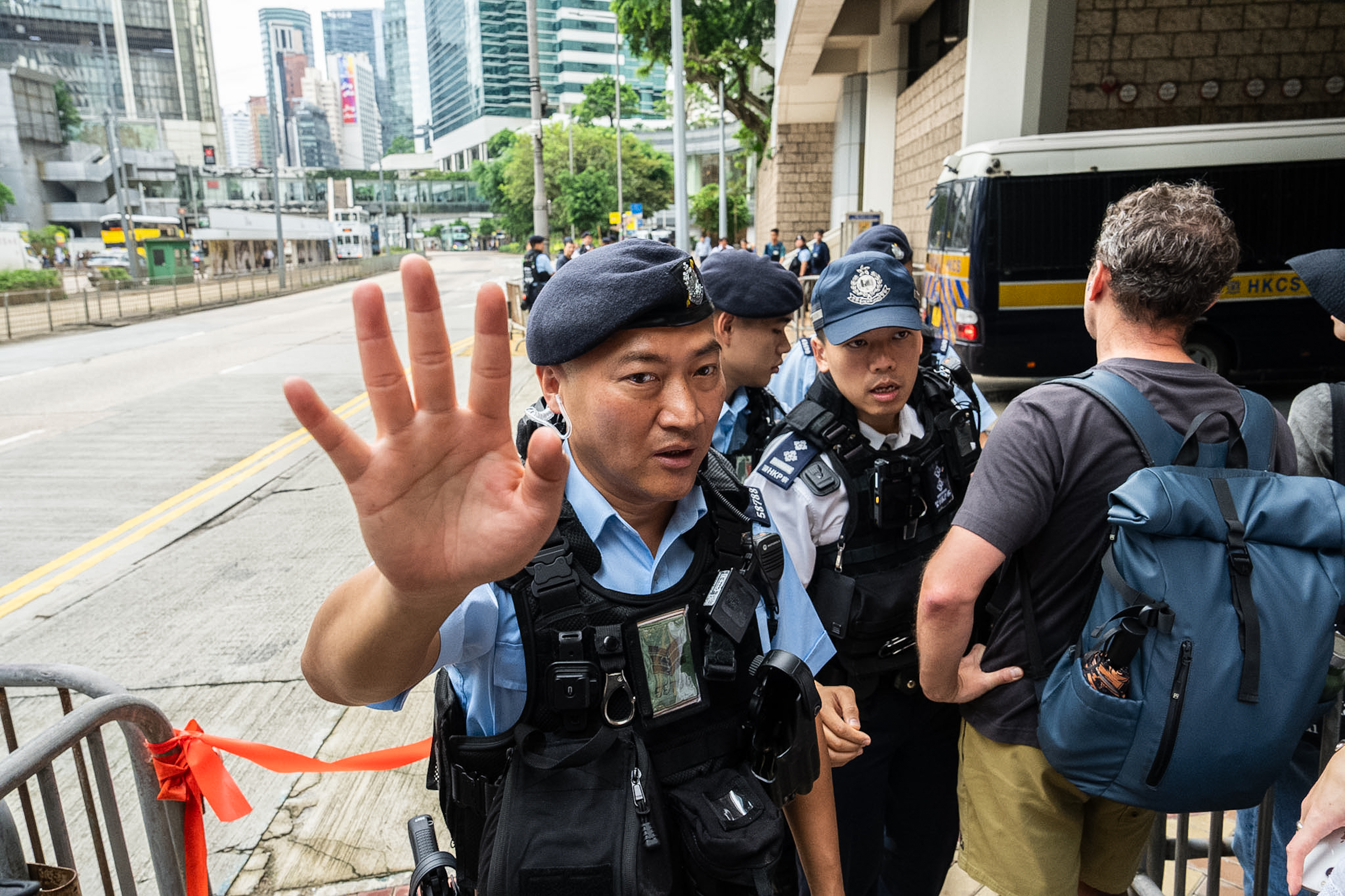 Police officers stand guard outside the High Court in Hong Kong, Sept. 2, 2026.