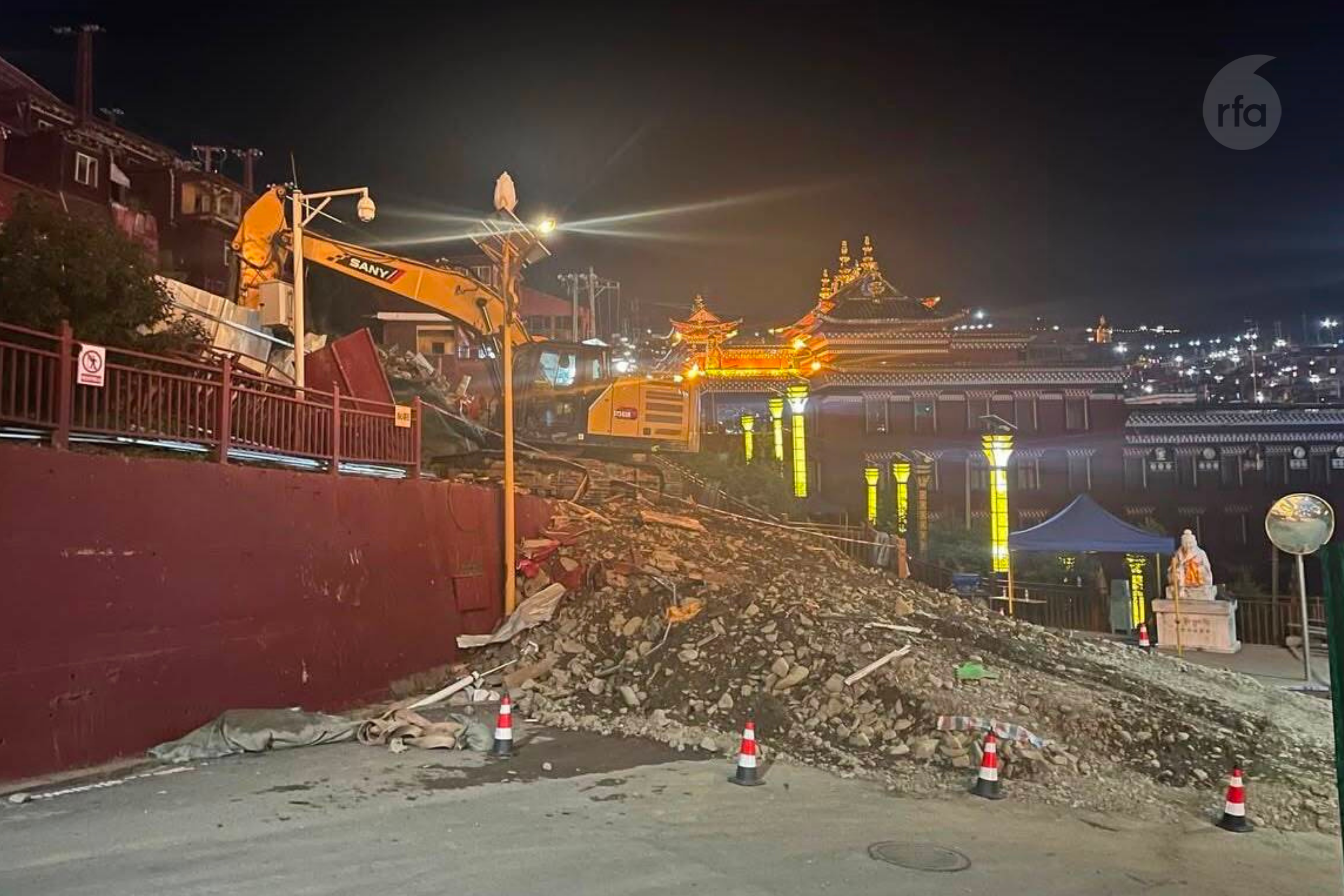 A photo received by RFA Tibetan on Aug. 11, 2026, shows demolition work at night at Larung Gar.