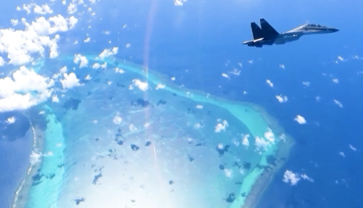 A Su-30 fighter jet from China’s Southern Theater Command is seen flying over Scarborough Shoal in the South China Sea on Dec. 29, 2024.