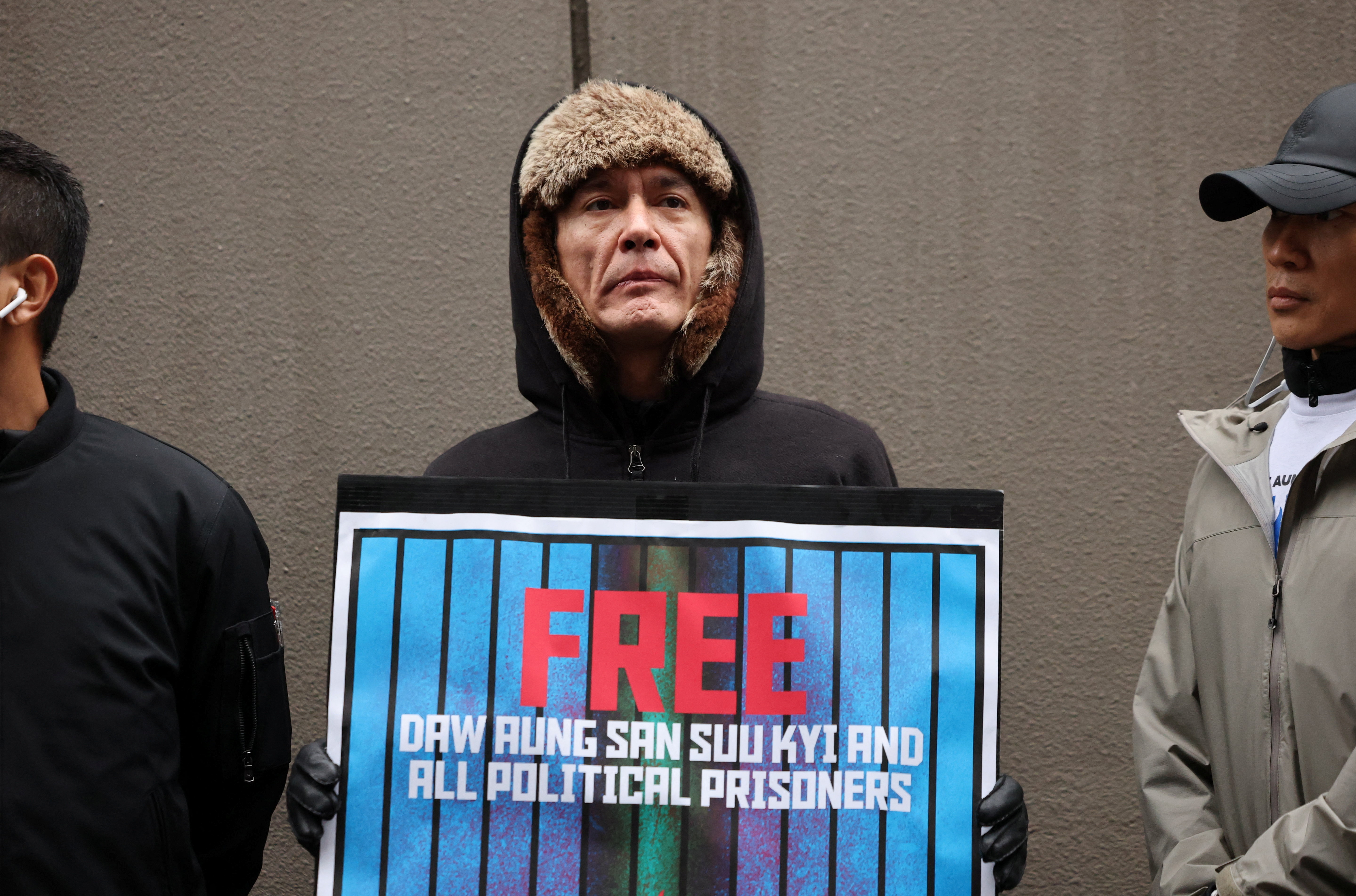 Kim Aris, the son of Aung San Suu Kyi, takes part in a protest denouncing an upcoming election led by the military junta and demanding the immediate release of Myanmar's detained former leader Aung San Suu Kyi and all political prisoners, in Tokyo, Dec. 14, 2025.