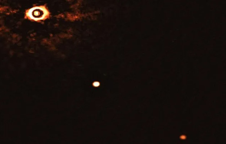 Captan la primera imagen de dos exoplanetas alrededor de una estrella similar al sol