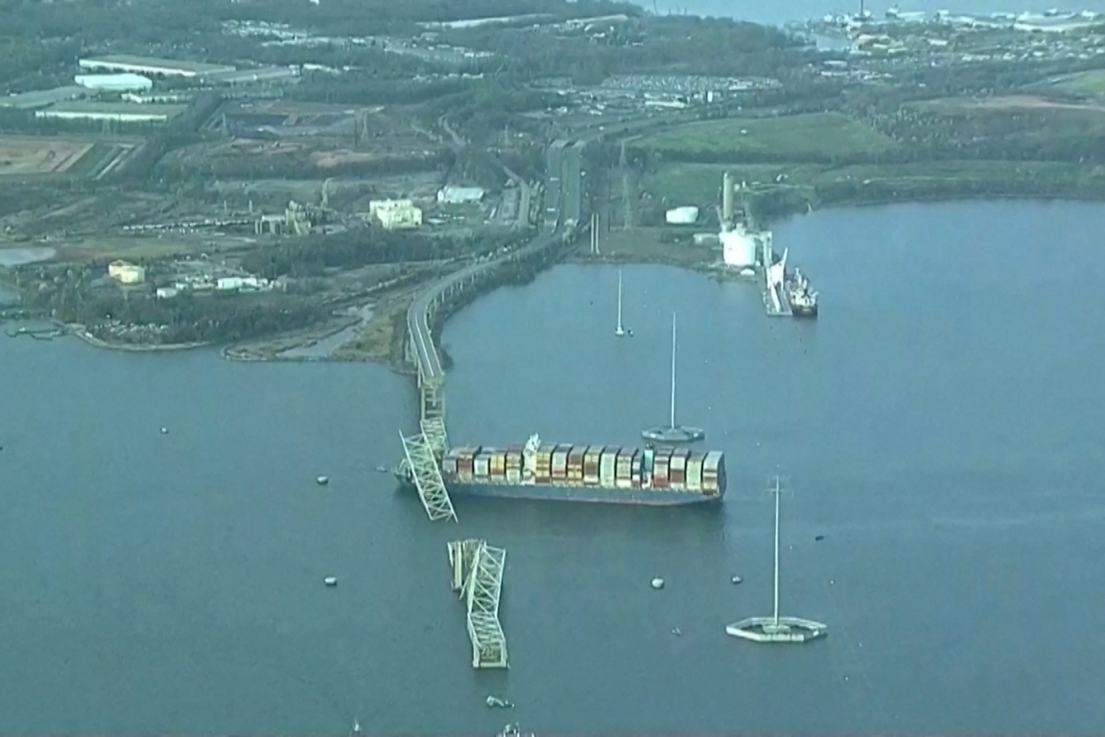 An aerial view of the Dali cargo vessel which crashed into the Francis Scott Key Bridge causing it to collapse in Baltimore, Maryland, U.S., March 26, 2024, in this still image taken from a video.   ABC AFFILIATE WJLA via REUTERS.  NO RESALES. NO ARCHIVES. MANDATORY CREDIT. THIS IMAGE HAS BEEN SUPPLIED BY A THIRD PARTY