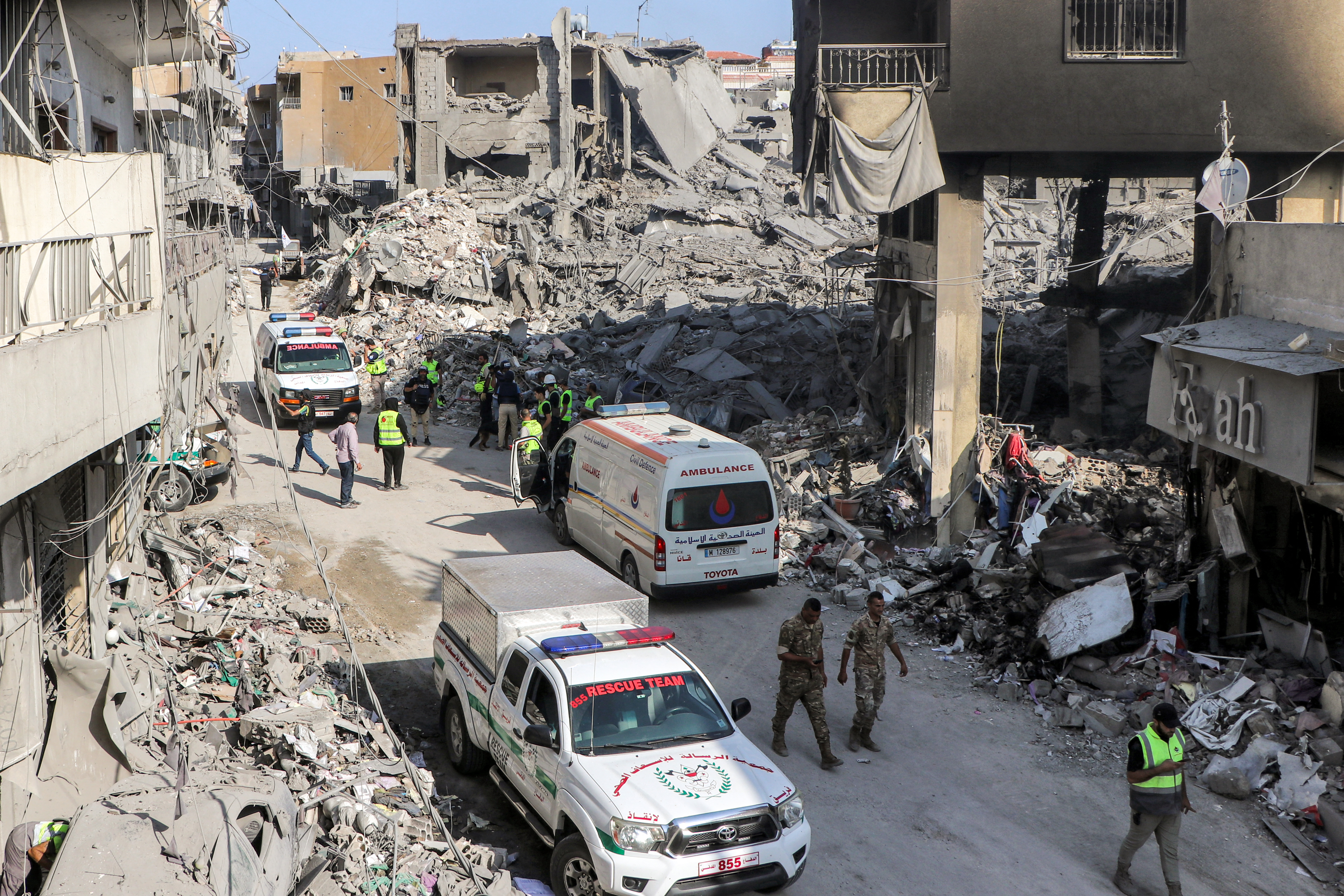 Civil defence rescue vehicles arrive at the site of an overnight Israeli air strike on the village of Qana in southern Lebanon on October 16, 2024. Israel expanded operations in Lebanon nearly a year after Hezbollah began exchanging fire in support of its ally, Hamas, following the Palestinian group's deadly attack on Israel on October 7, 2023. (Photo by Bilal KASHMAR / AFP)