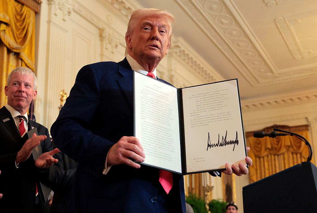 WASHINGTON, DC - APRIL 08: U.S. President Donald Trump holds an executive orders after signing a series of orders on American energy production during a ceremony in the East Room of the White House on April 08, 2025 in Washington, DC. The Trump administration has elected to roll back Biden-era environmental policies with the intention to help revive coal-fired plants in order to restore America’s energy independence. Trump was joined by Energy Secretary Chris Wright. (Photo by Anna Moneymaker/Getty Images)