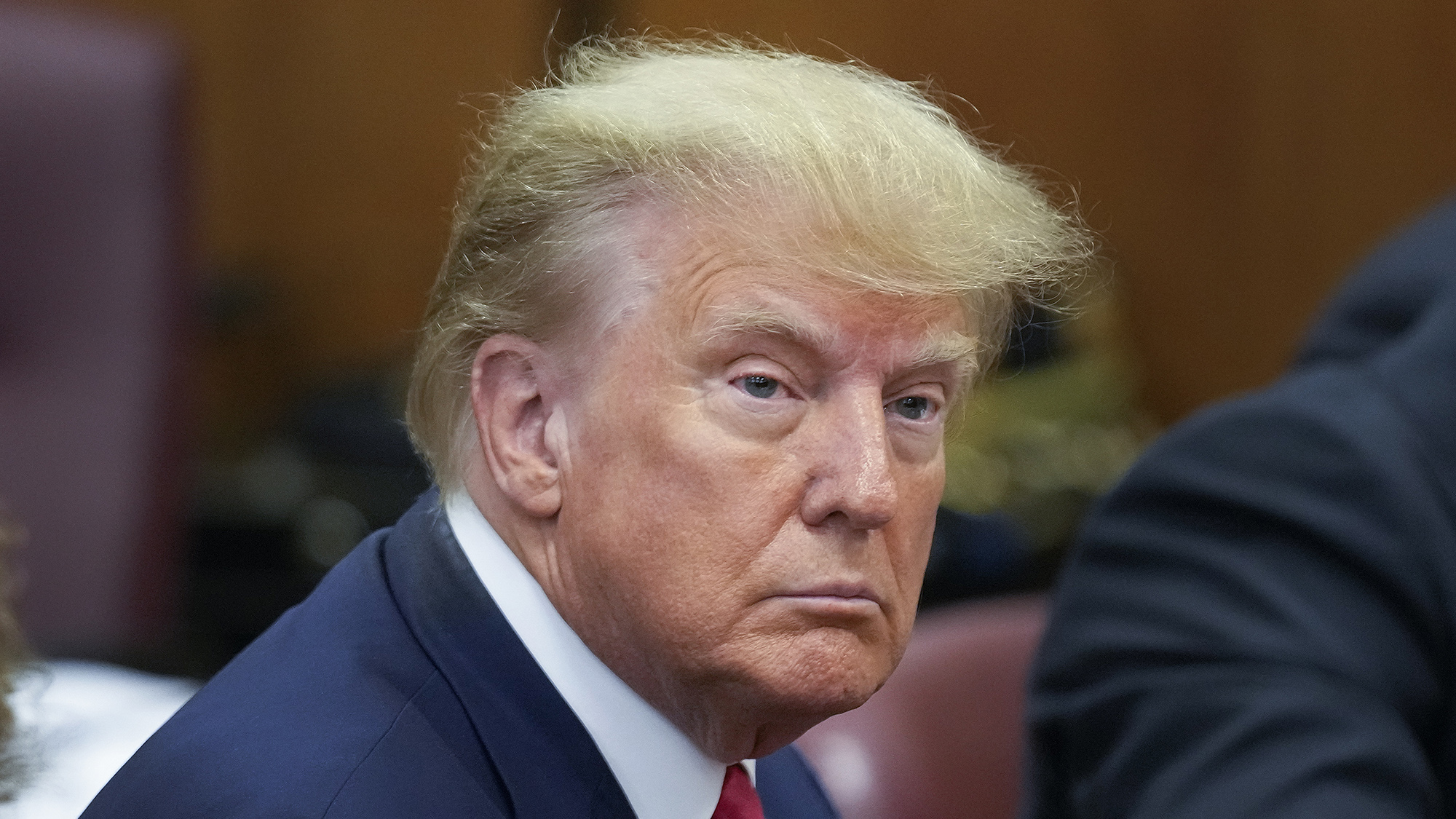 Former President Donald Trump sits at the defense table with his defense team in a Manhattan court, Tuesday, April 4, 2023, in New York. Trump is set to appear in a New York City courtroom on charges related to falsifying business records in a hush money investigation, the first president ever to be charged with a crime. (AP Photo/Seth Wenig)