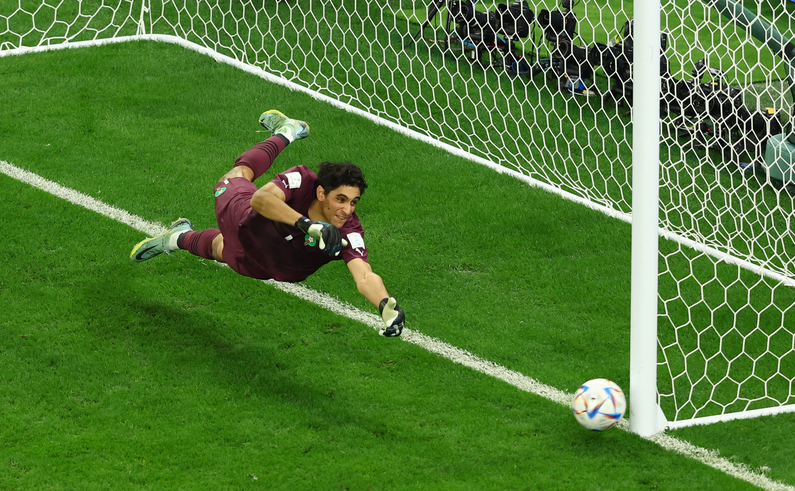 Soccer Football - FIFA World Cup Qatar 2022 - Round of 16 - Morocco v Spain - Education City Stadium, Al Rayyan, Qatar - December 6, 2022 Morocco's Yassine Bounou in action as Spain's Pablo Sarabia misses a penalty during the penalty shootout REUTERS/Lee Smith