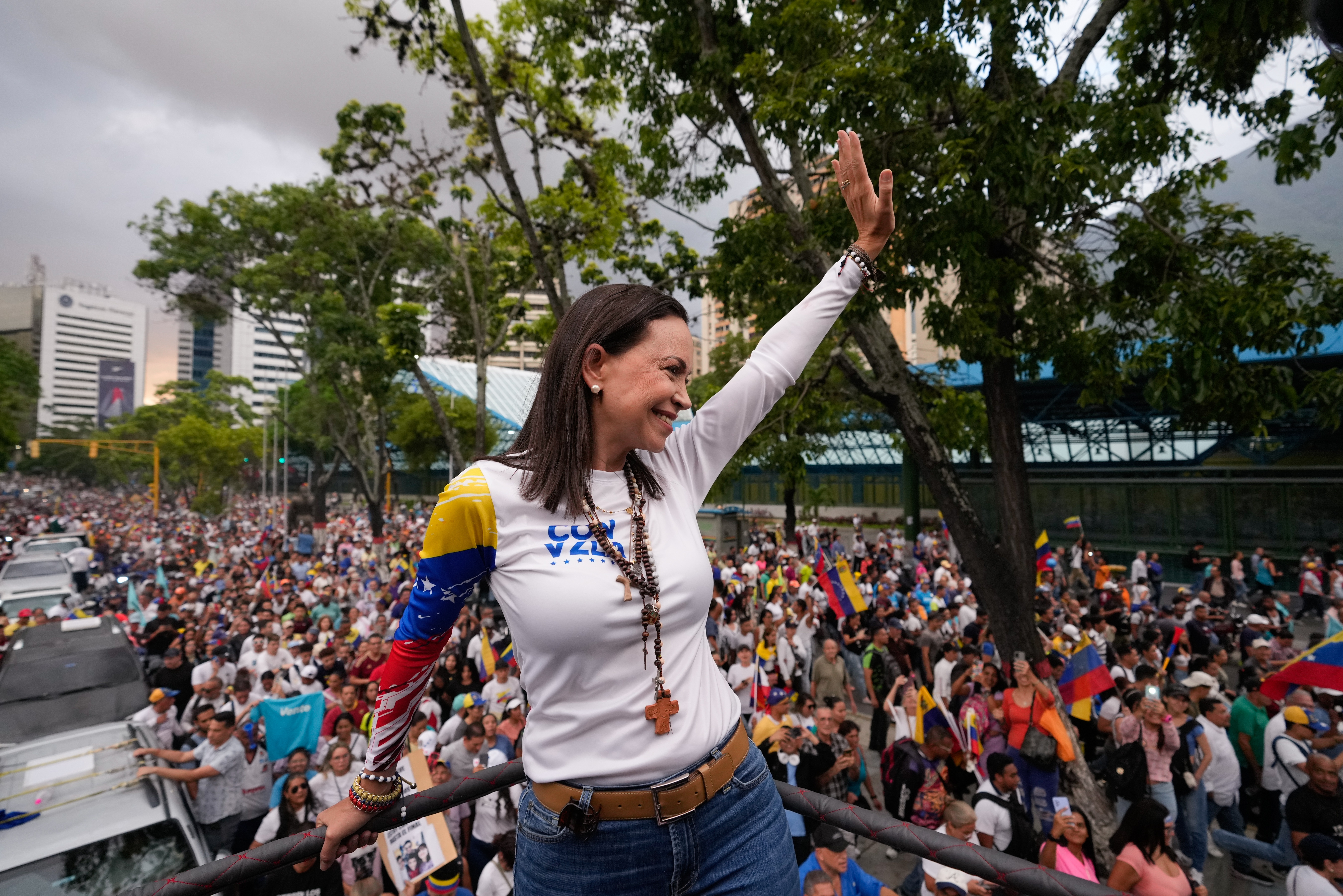 Opposition leader Maria Corina Machado waves during a rally launching the official presidential campaign season, in Caracas, Venezuela, Thursday, July 4, 2024. Venezuelans head to the polls on July 28 as President Nicolas Maduro seeks a third term. (AP Photo/Ariana Cubillos)