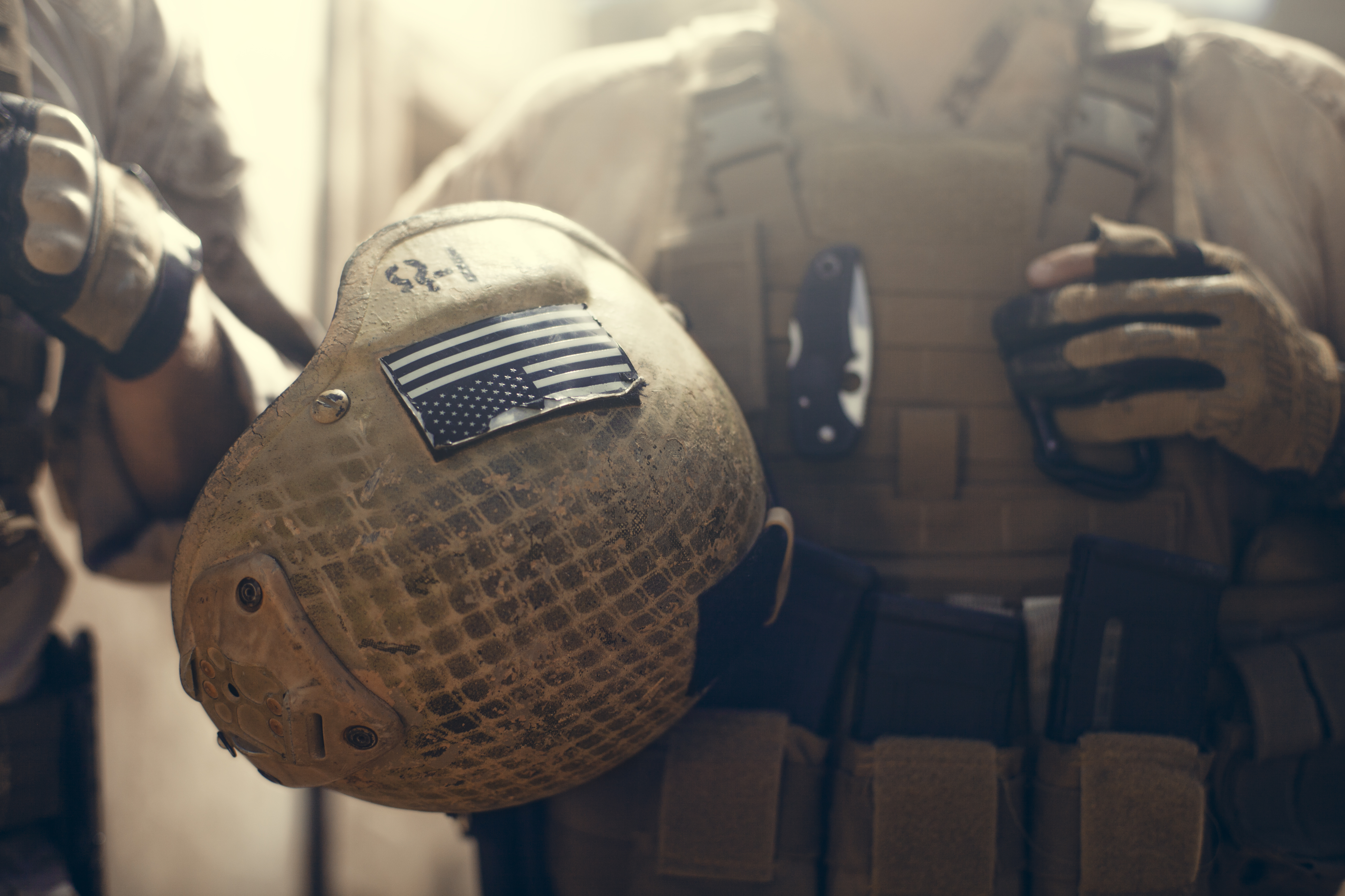 American flag on helmet of US Marine soldier.